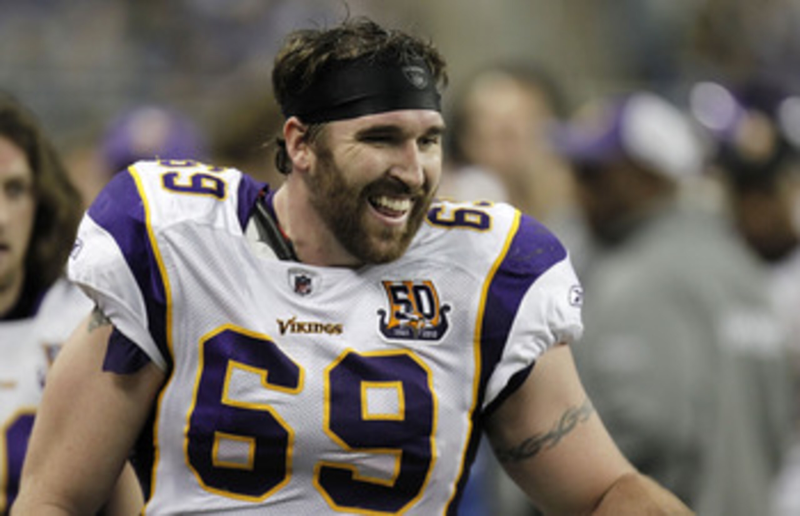 DETROIT, MI - JANUARY 02:  Jared Allen #69 of the Minnesota Vikings smiles on the bench after returning an interception for a touchdown while playing the Detroit Lions at Ford Field on January 2, 2011 in Detroit, Michigan. Detroit won the game 20-13.  (Ph