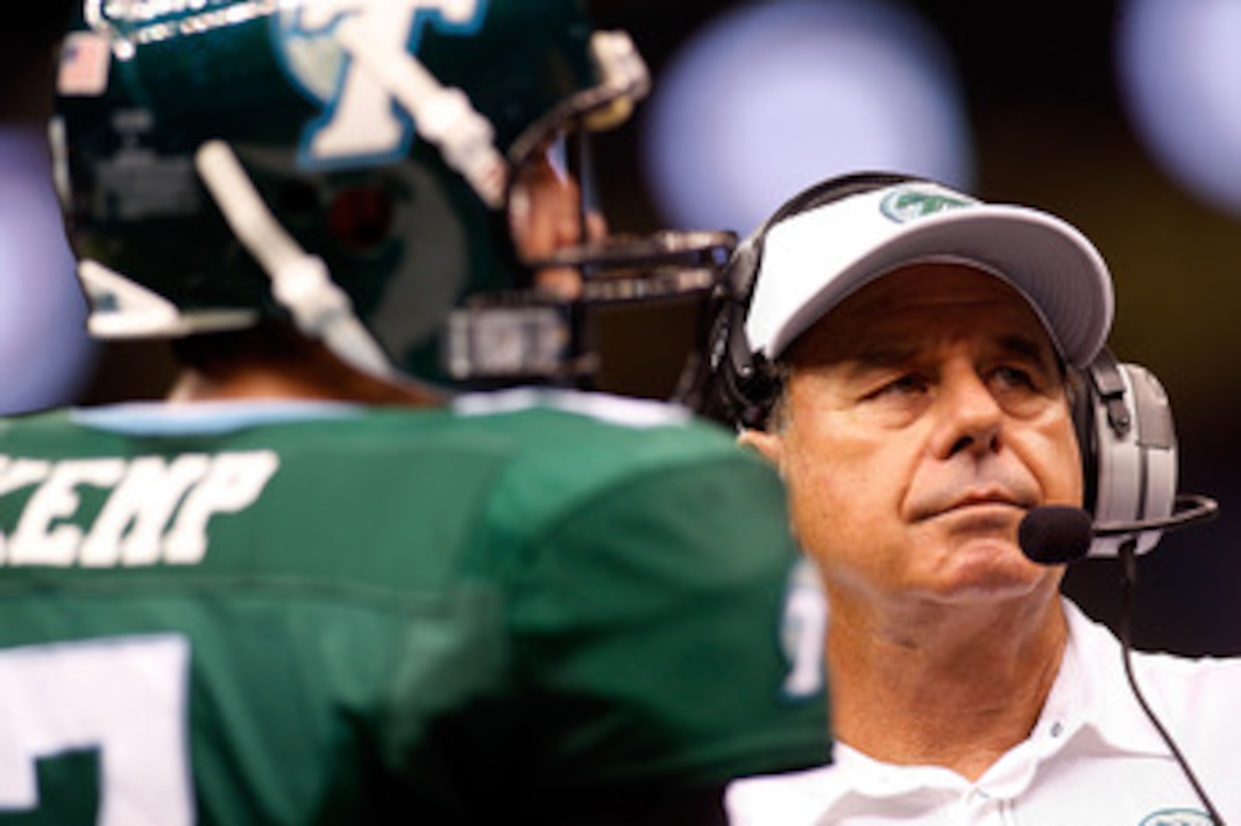 NEW ORLEANS - SEPTEMBER 04:  Head coach Bob Toledo talks with quarterback Joe Kemp #7 of the Tulane Green Wave during a timeout against the Tulsa Golden Hurricanes at the Louisiana Superdome on September 4, 2009 in New Orleans, Louisiana.  (Photo by Chris