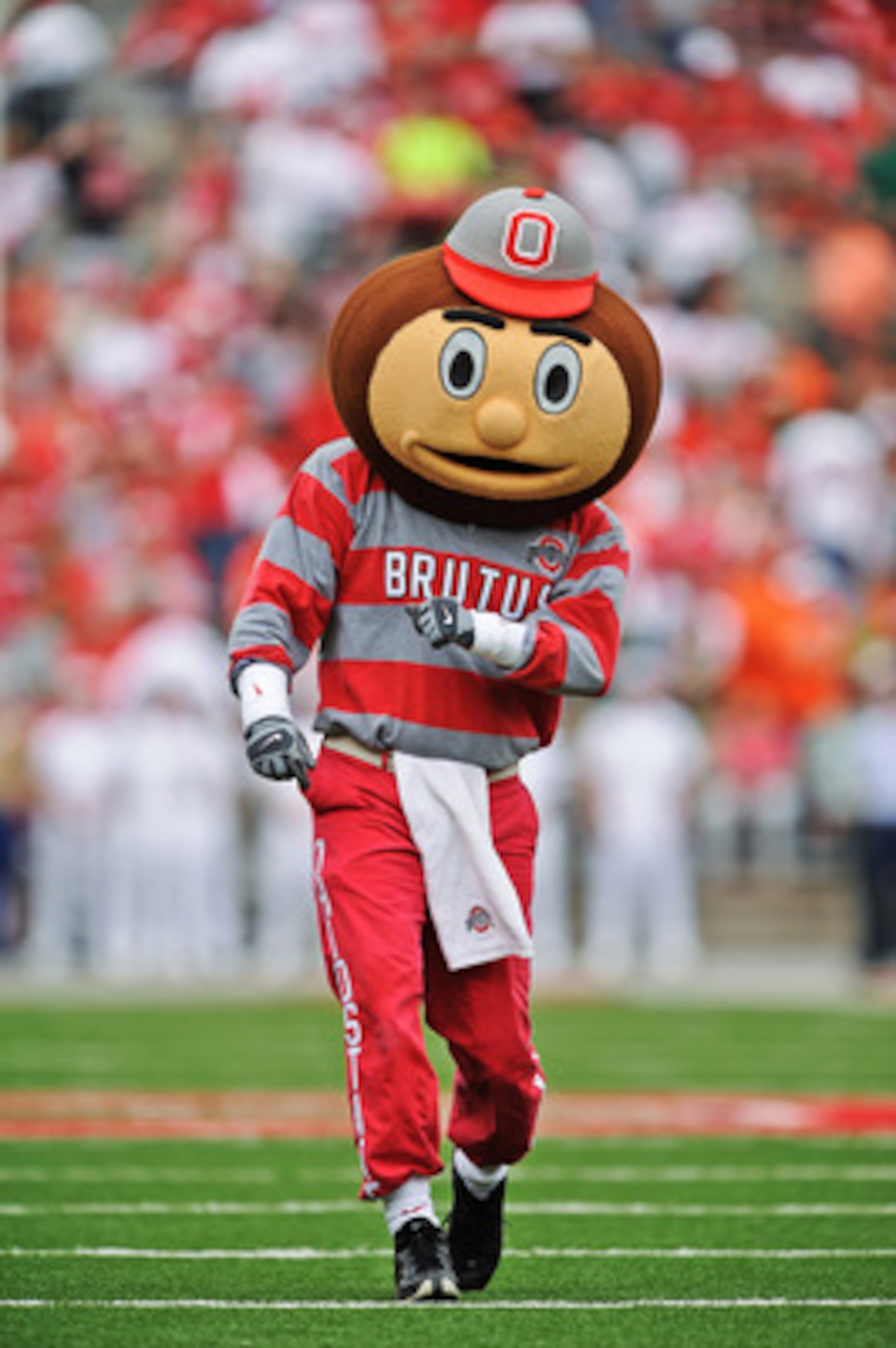 COLUMBUS, OH - SEPTEMBER 11:  Mascot Brutus Buckeye fires up the crowd before a game against the Miami Hurricanes at Ohio Stadium on September 11, 2010 in Columbus, Ohio.  (Photo by Jamie Sabau/Getty Images)