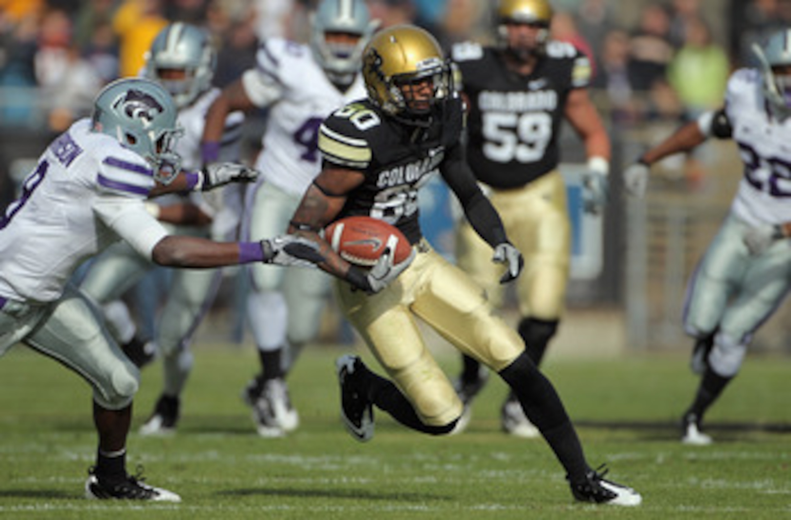 BOULDER, CO - NOVEMBER 20:  Wide receiver Paul Richardson #80 of the Colorado Buffaloes makes a pass reception for a first down against the Kansas State Wildcats at Folsom Field on November 20, 2010 in Boulder, Colorado. Colorado defeated Kansas State 44-