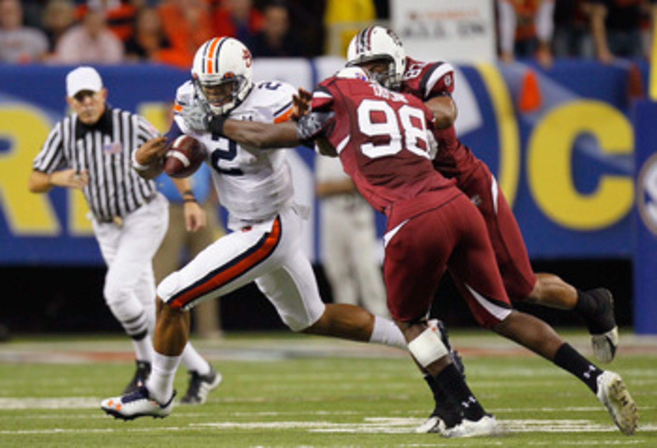 ATLANTA, GA - DECEMBER 04: Devin Taylor #98 and Cliff Matthews #83 of the South Carolina Gamecocks force a fumble by quarterback Cam Newton #2 of the Auburn Tigers during the 2010 SEC Championship at Georgia Dome on December 4, 2010 in Atlanta, Georgia. ATLANTA, GA - DECEMBER 04: Devin Taylor #98 and Cliff Matthews #83 of the South Carolina Gamecocks force a fumble by quarterback Cam Newton #2 of the Auburn Tigers during the 2010 SEC Championship at Georgia Dome on December 4, 2010 in Atlanta, Georgia.