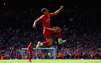 LIVERPOOL, ENGLAND - MAY 01:  Maxi Rodriguez of Liverpool leaps into the air to celebrate after scoring the first goal during the Barclays Premier League match between Liverpool  and Newcastle United at Anfield on May 1, 2011 in Liverpool, England.  (Phot
