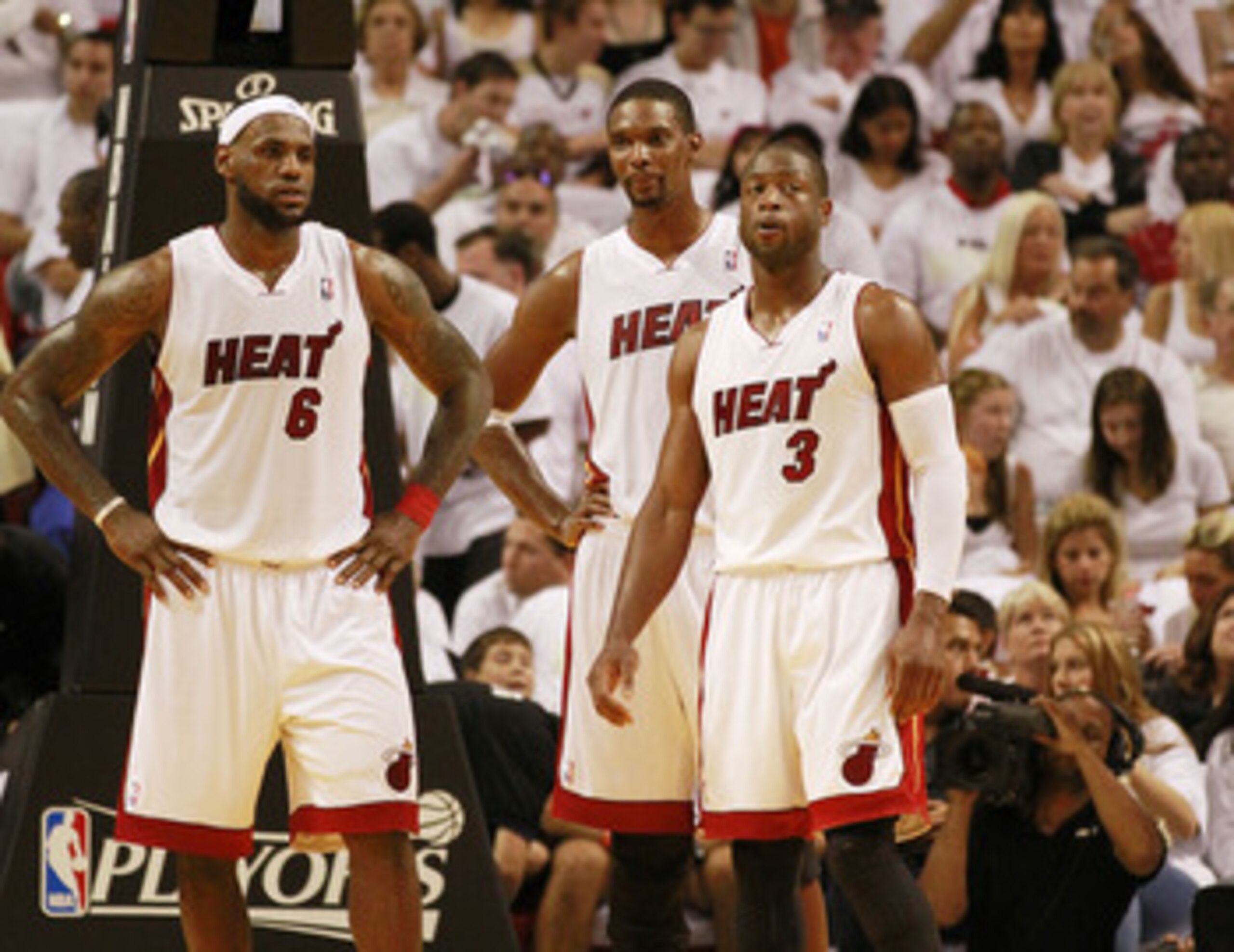 MIAMI, FL - APRIL 16:  Forward Chris Bosh #1 of the  Miami Heat with teammates Dwyane Wade #3 and LeBron James #6 against the Philadelphia 76ers at the American Airlines Arena in game one of the Eastern Conference Quarterfinals in the 2011 NBA Playoffs on