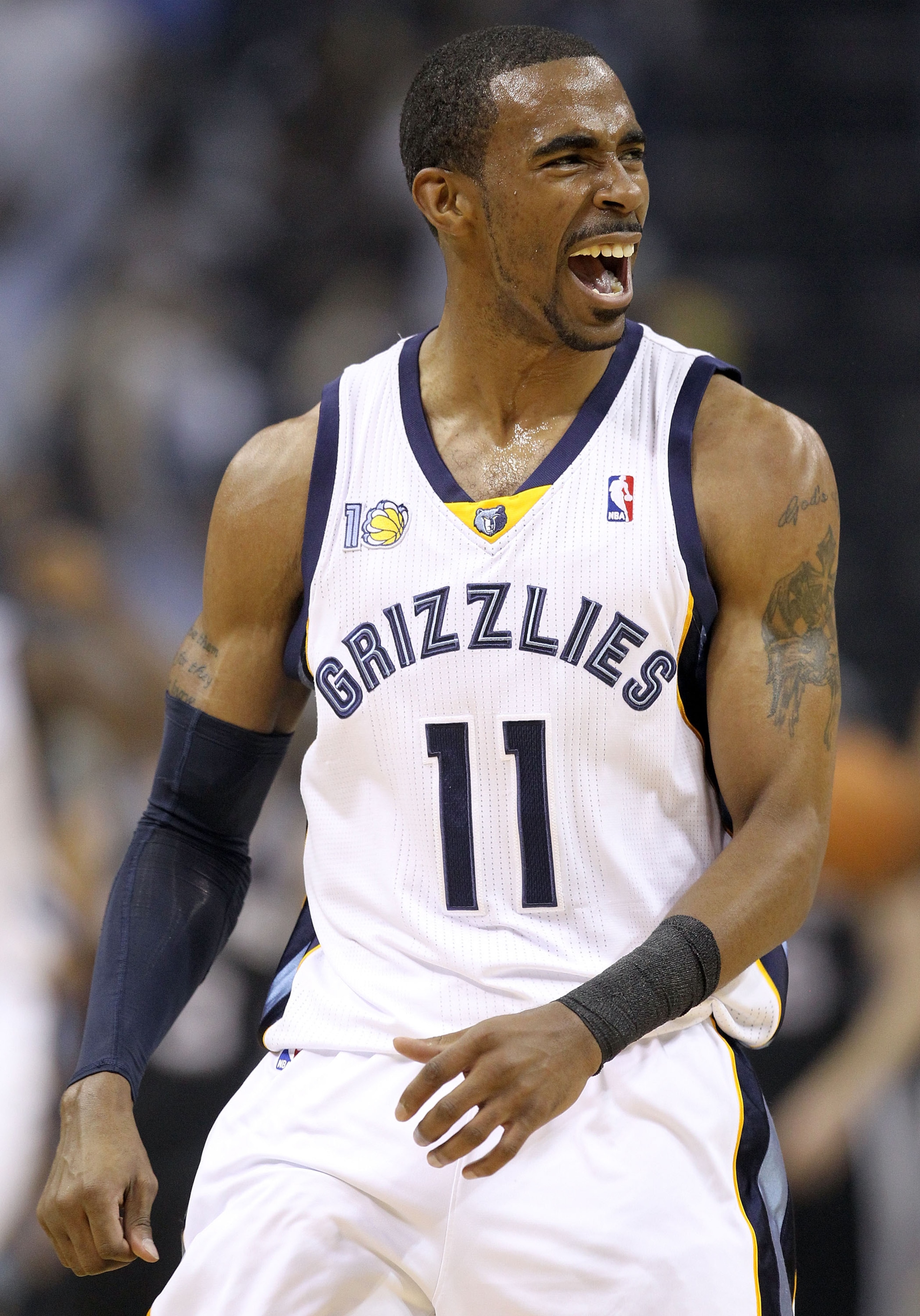 MEMPHIS, TN - APRIL 23:  Mike Conley #11 of the  Memphis Grizzles celebrates during the game against the San Antonio Spurs in Game three of the Western Conference Quarterfinals in the 2011 NBA Playoffs at FedExForum on April 23, 2011 in Memphis, Tennessee