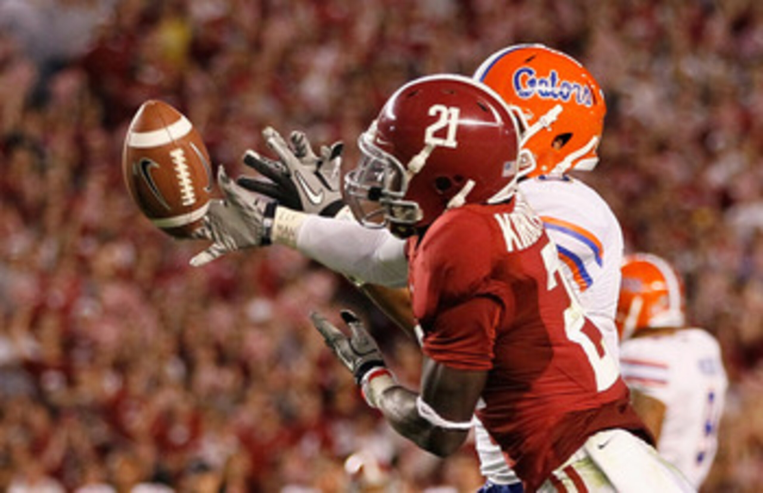 TUSCALOOSA, AL - OCTOBER 02: Dre Kirkpatrick #21 of the Alabama Crimson Tide intercepts a pass intended for Trey Burton #8 of the Florida Gators at Bryant-Denny Stadium on October 2, 2010 in Tuscaloosa, Alabama. (Photo by Kevin C. Cox/Getty Images) TUSCALOOSA, AL - OCTOBER 02: Dre Kirkpatrick #21 of the Alabama Crimson Tide intercepts a pass intended for Trey Burton #8 of the Florida Gators at Bryant-Denny Stadium on October 2, 2010 in Tuscaloosa, Alabama. (Photo by Kevin C. Cox/Getty Images)