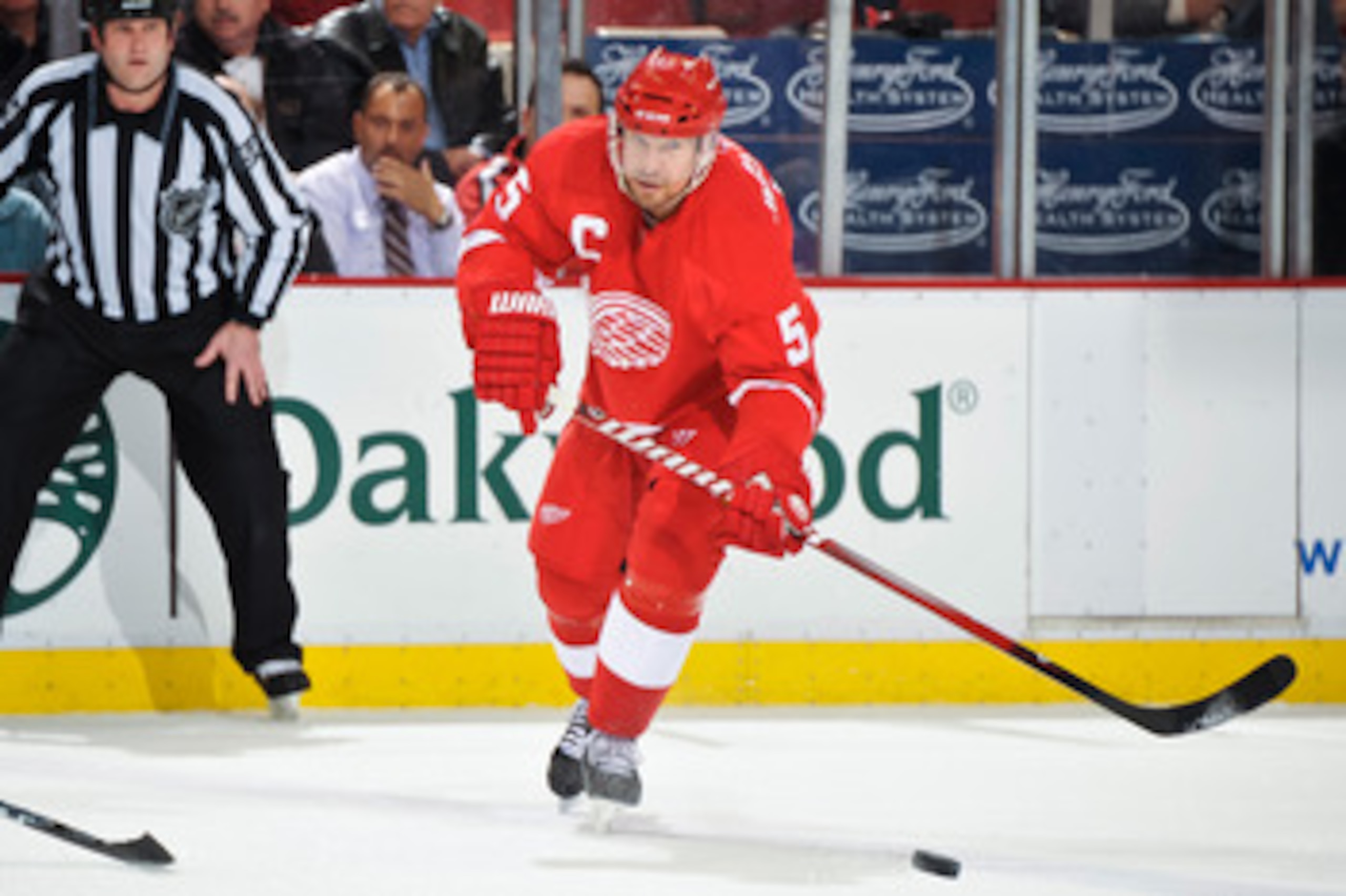 DETROIT - MAY 4: Nicklas Lidstrom #5 of the Detroit Red Wings skates with the puck against the San Jose Sharks in Game Three of the Western Conference Semifinals during the 2011 NHL Stanley Cup Playoffs on May 4, 2011 at Joe Louis Arena in Detroit, Michig