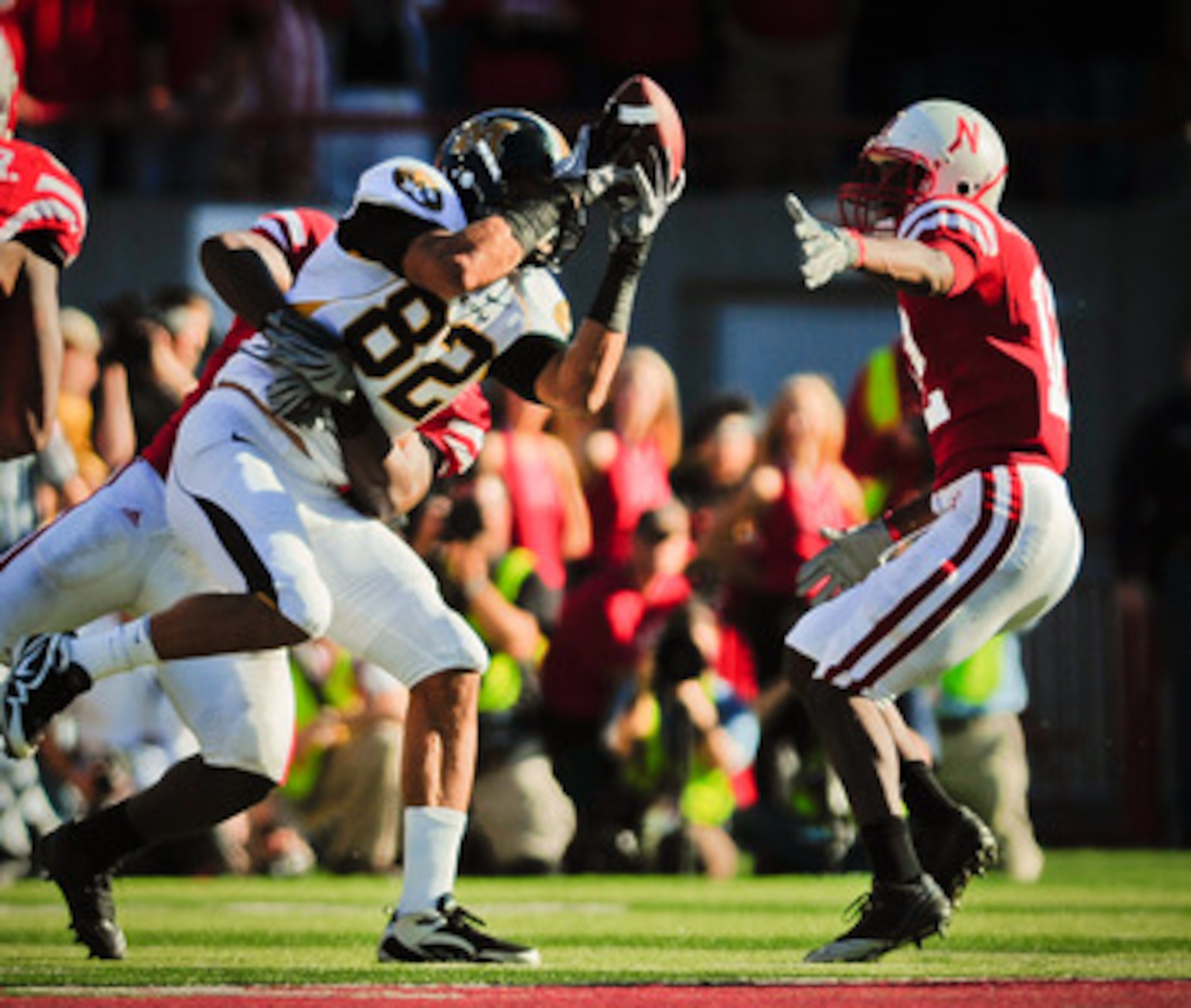 LINCOLN, NE - OCTOBER 30: Tight end Michael Egnew #82 of the Missouri Tigers attempts to haul in a pass in front of safety Courtney Osborne #12 of the Nebraska Cornhuskers during second half action of their game at Memorial Stadium on October 30, 2010 in 