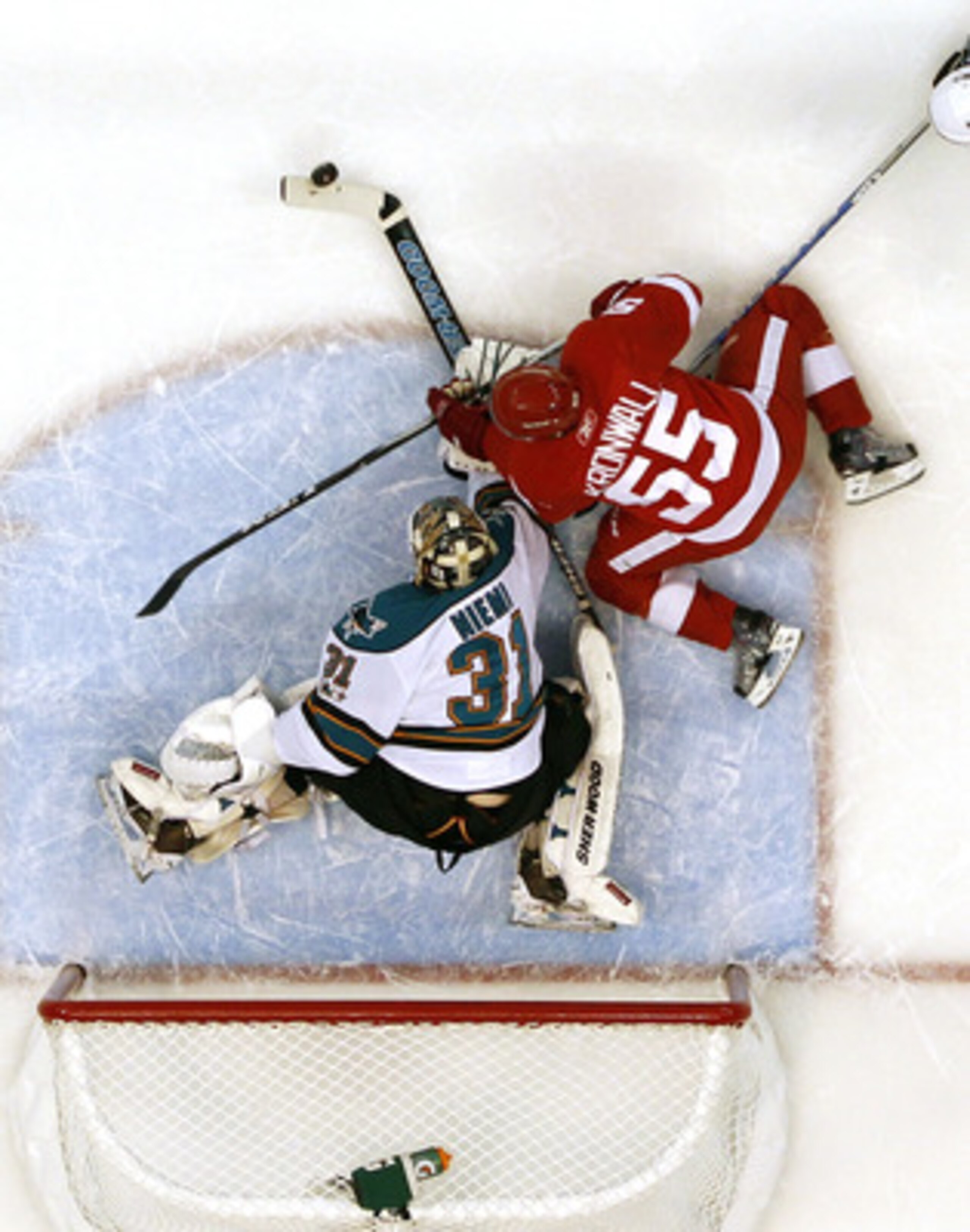 DETROIT - MAY 10: Antti Niemi #31 of the San Jose Sharks stops a first period shot by Niklas Kronwall #55 of the Detroit Red Wings in Game Six of the Western Conference Semifinals during the 2011 NHL Stanley Cup Playoffs on May 10, 2011 at Joe Louis Arena