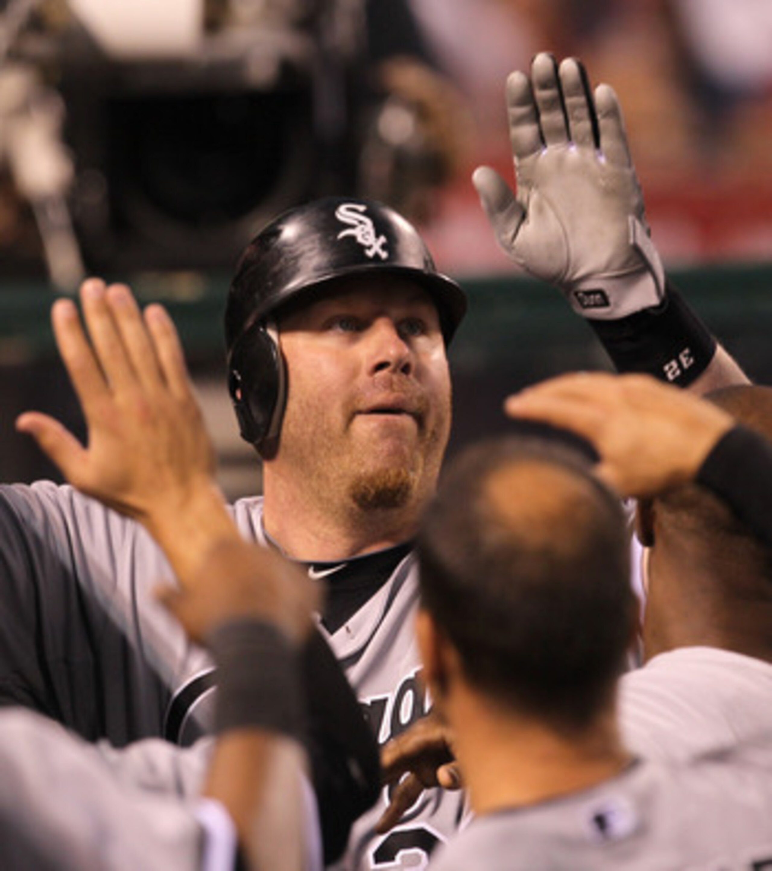 ANAHEIM, CA - MAY 11:  Adam Dunn #32 of the Chicago White Sox is greeted by teammates in the dugout after hitting a solo home run in the  thiird inning against the Los Angeles Angels of Anaheim on May 11, 2011 at Angel Stadium in Anaheim, California.   (P