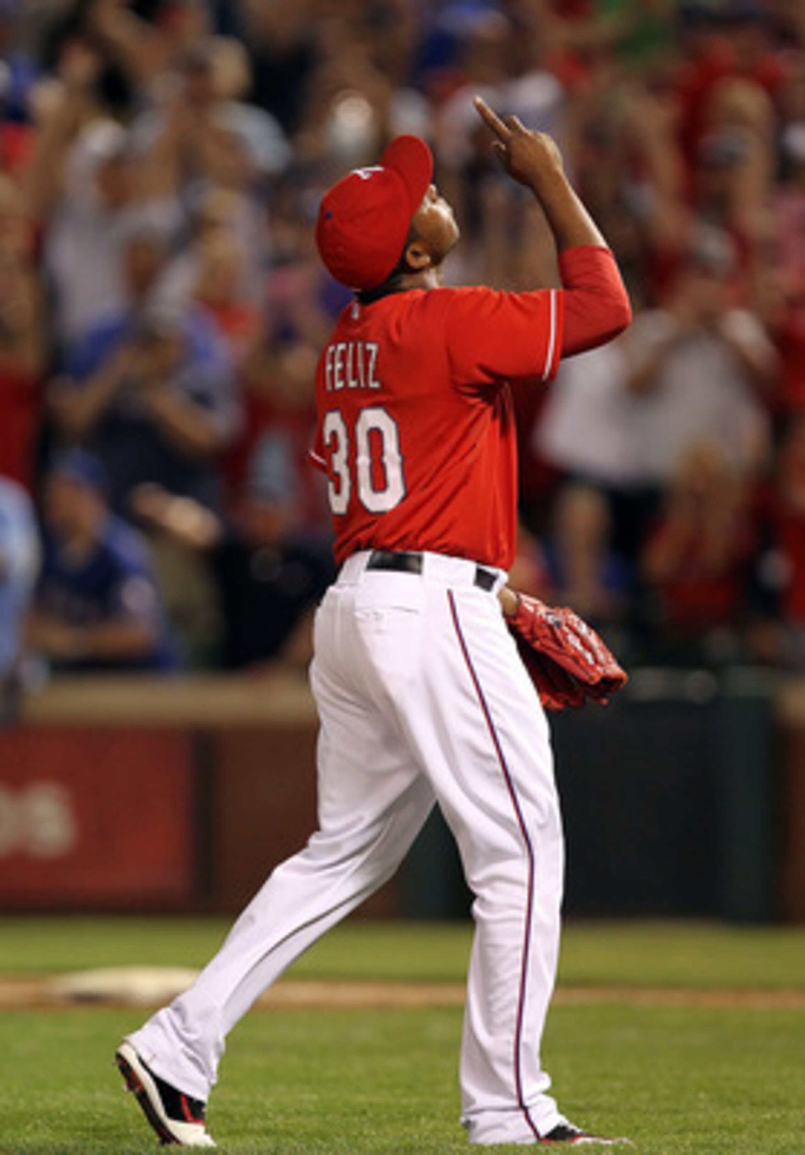 ARLINGTON, TX - MAY 07:  Pitcher Neftali Feliz #30 of the Texas Rangers reacts after a 7-5 win against the New York Yankees at Rangers Ballpark in Arlington on May 7, 2011 in Arlington, Texas.  (Photo by Ronald Martinez/Getty Images)