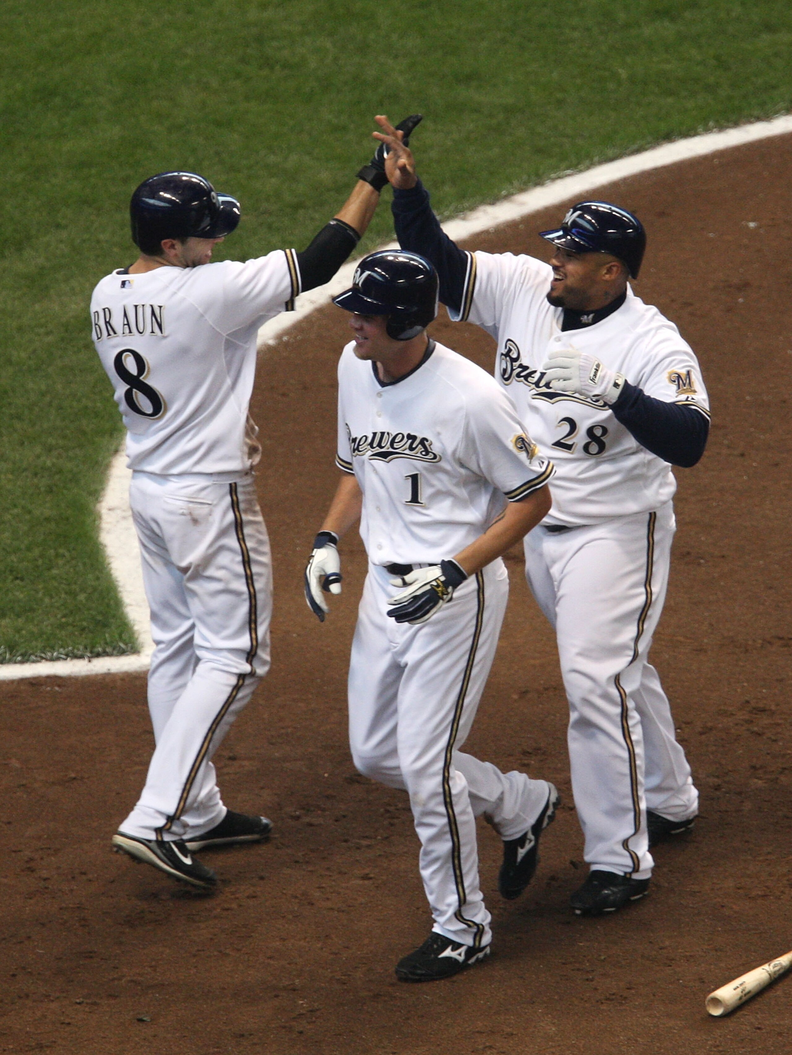 MILWAUKEE - JUNE 04: Ryan Braun #8 (L) and Prince Fiedler #28 (R) of the Milwaukee Brewers celebrate after teammate Corey Hart #1 hit a three-run, inside-the-park home run in the 4th inning against the Arizona Diamondbacks on June 4, 2008 at Miller Park i