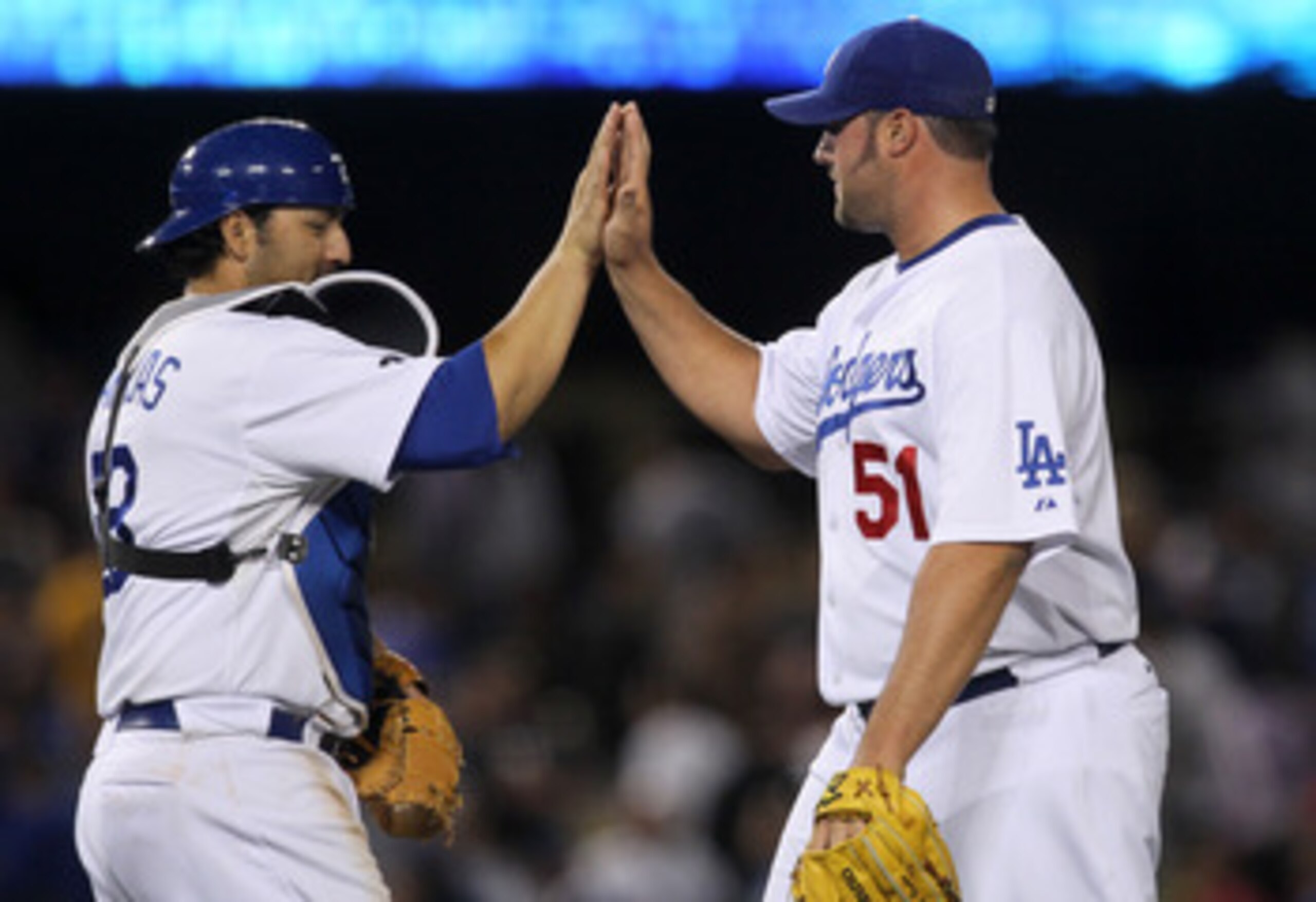LOS ANGELES - MAY 2:  Closer Jonathan Broxton #51 and catcher Rod Barajas #28 of the Los Angeles Dodgers celebrate after the game with the Chicago Cubs  on May 2, 2011 at Dodger Stadium in Los Angeles, California. Broxton picked up the save as the Dodgers