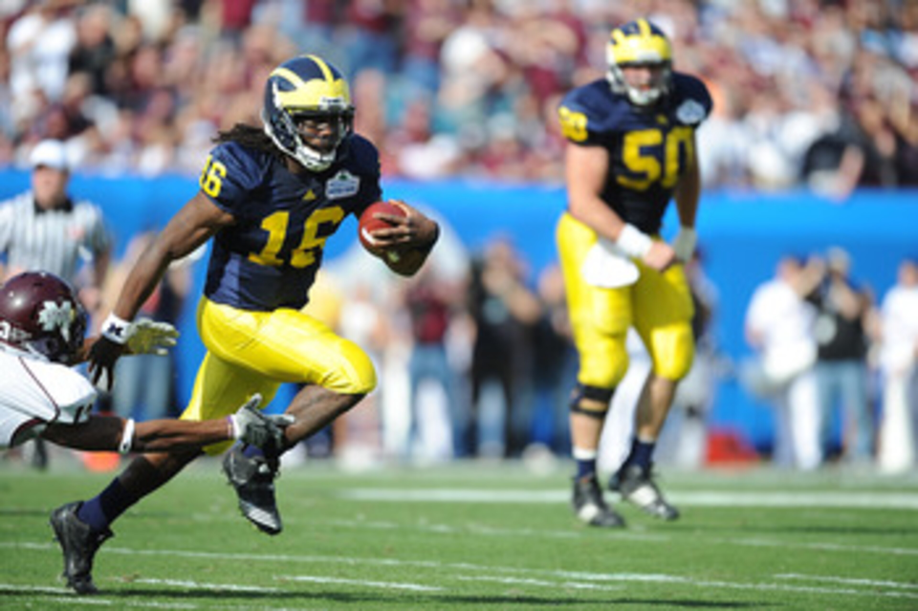 JACKSONVILLE, FL - JANUARY 01: Quarterback Denard Robinson #16 of the Michigan Wolverines rushes against the Mississippi State Bulldogs during the Gator Bowl at EverBank Field on January 1, 2011 in Jacksonville, Florida (Photo by Rick Dole/Getty Images) JACKSONVILLE, FL - JANUARY 01: Quarterback Denard Robinson #16 of the Michigan Wolverines rushes against the Mississippi State Bulldogs during the Gator Bowl at EverBank Field on January 1, 2011 in Jacksonville, Florida (Photo by Rick Dole/Getty Images)