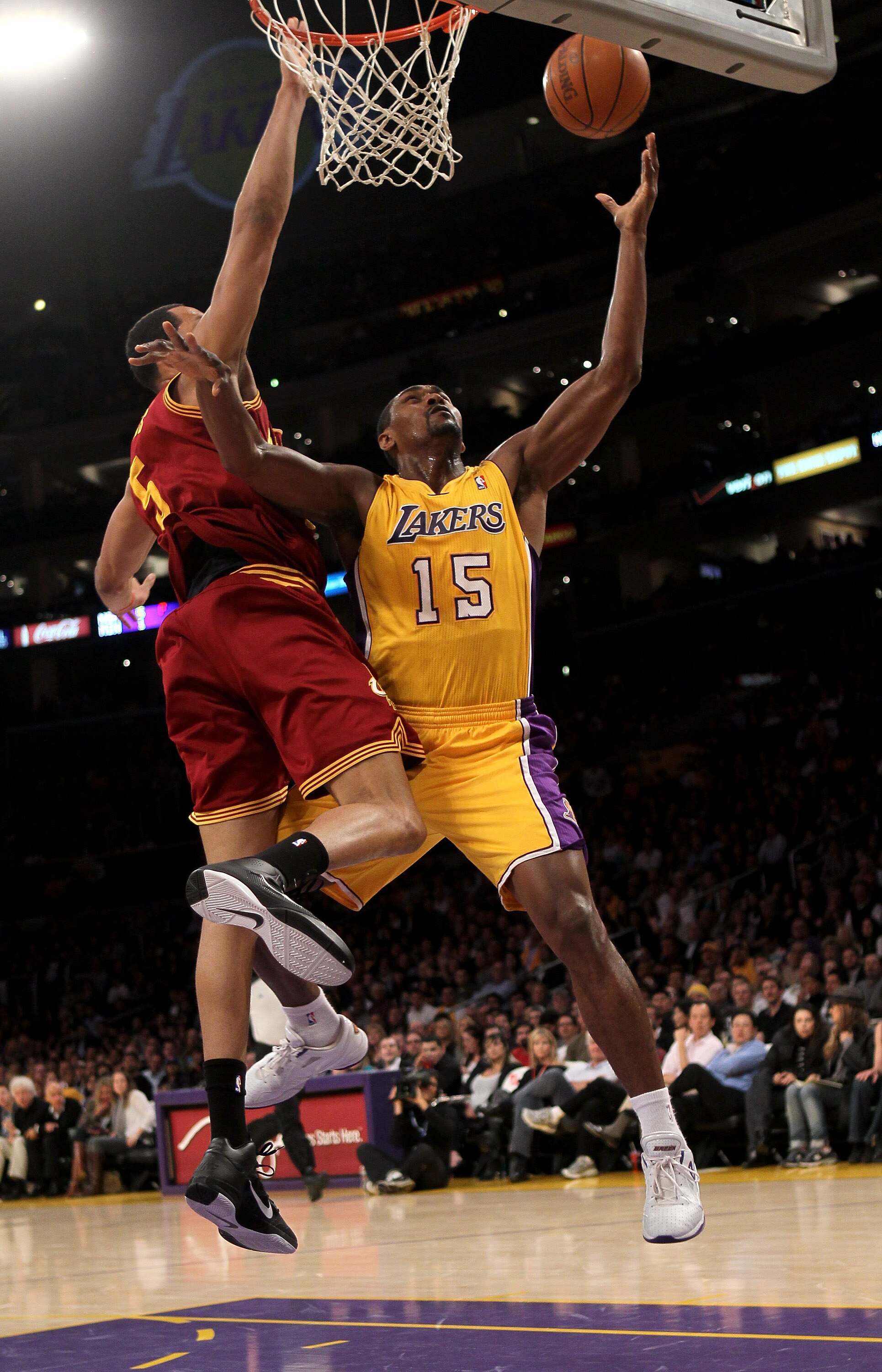LOS ANGELES, CA - JANUARY 11:  Ron Artest #15 of the Los Angeles Lakers shoots over Ryan Hollins #5 the Cleveland Cavaliers at Staples Center on January 11, 2011 in Los Angeles, California.   NOTE TO USER: User expressly acknowledges and agrees that, by d