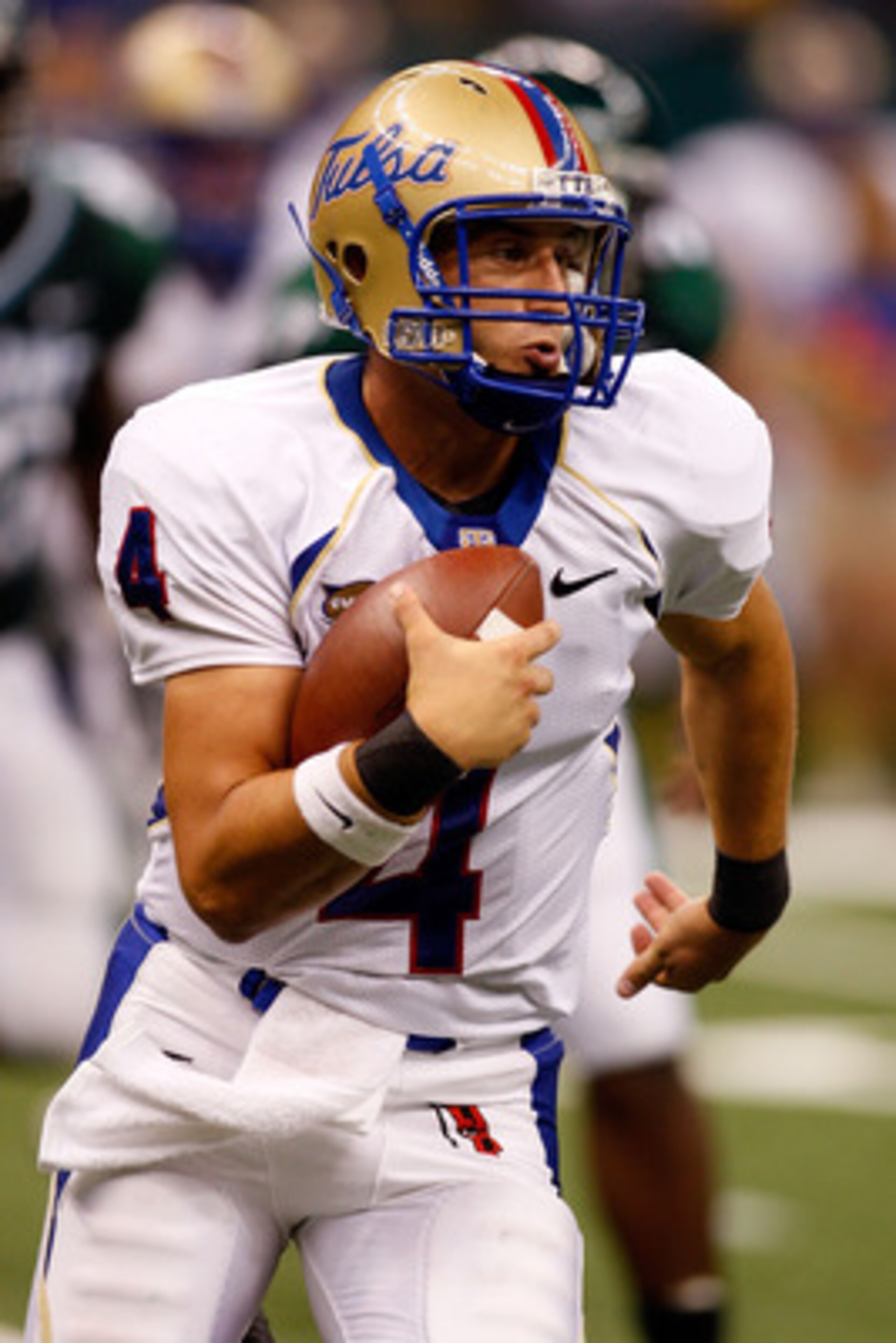 NEW ORLEANS - SEPTEMBER 04: Quarterback G.J. Kinne #4 of the Tulsa Golden Hurricanes scrambles with the football against the Tulane Green Wave at the Louisiana Superdome on September 4, 2009 in New Orleans, Louisiana. The Hurricanes defeated the Green NEW ORLEANS - SEPTEMBER 04: Quarterback G.J. Kinne #4 of the Tulsa Golden Hurricanes scrambles with the football against the Tulane Green Wave at the Louisiana Superdome on September 4, 2009 in New Orleans, Louisiana. The Hurricanes defeated the Green