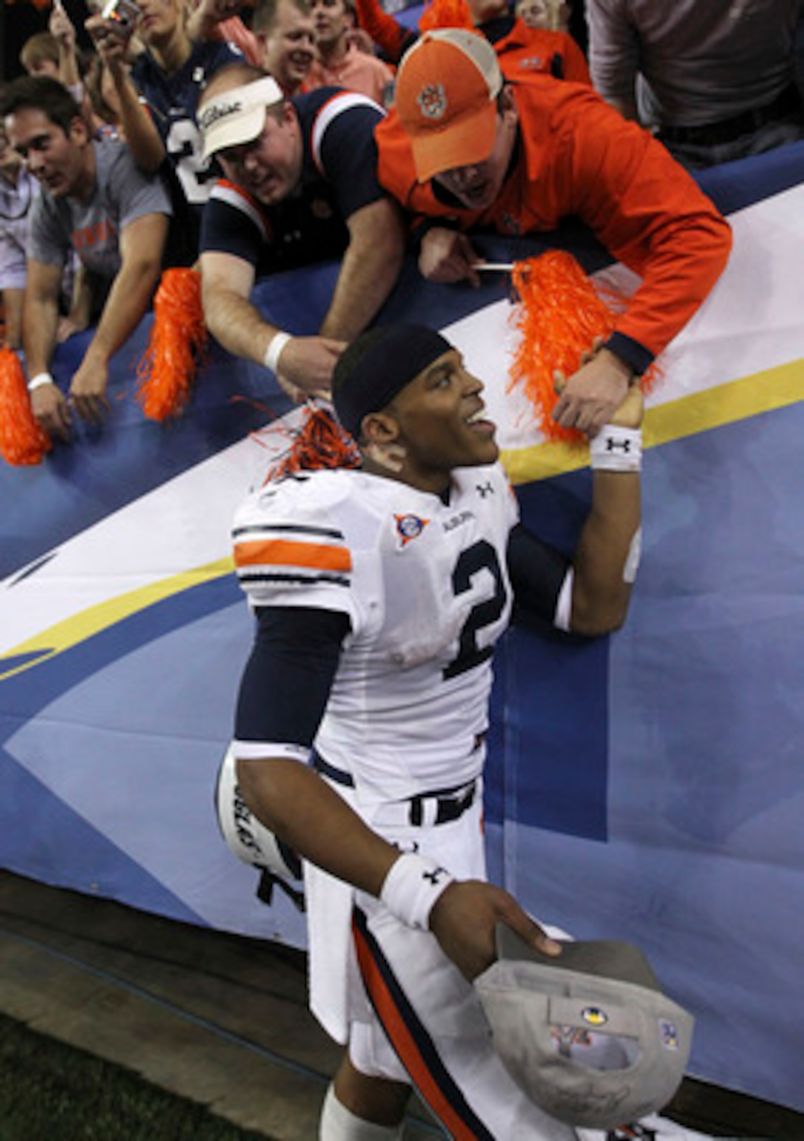 ATLANTA - DECEMBER 04:  Quarterback Cam Newton #2 of the Auburn Tigers celebrates with the crowd after the 2010 SEC Championship against the South Carolina Gamecocks at Georgia Dome on December 4, 2010 in Atlanta, Georgia.  The Tigers beat the Gamecocks 5