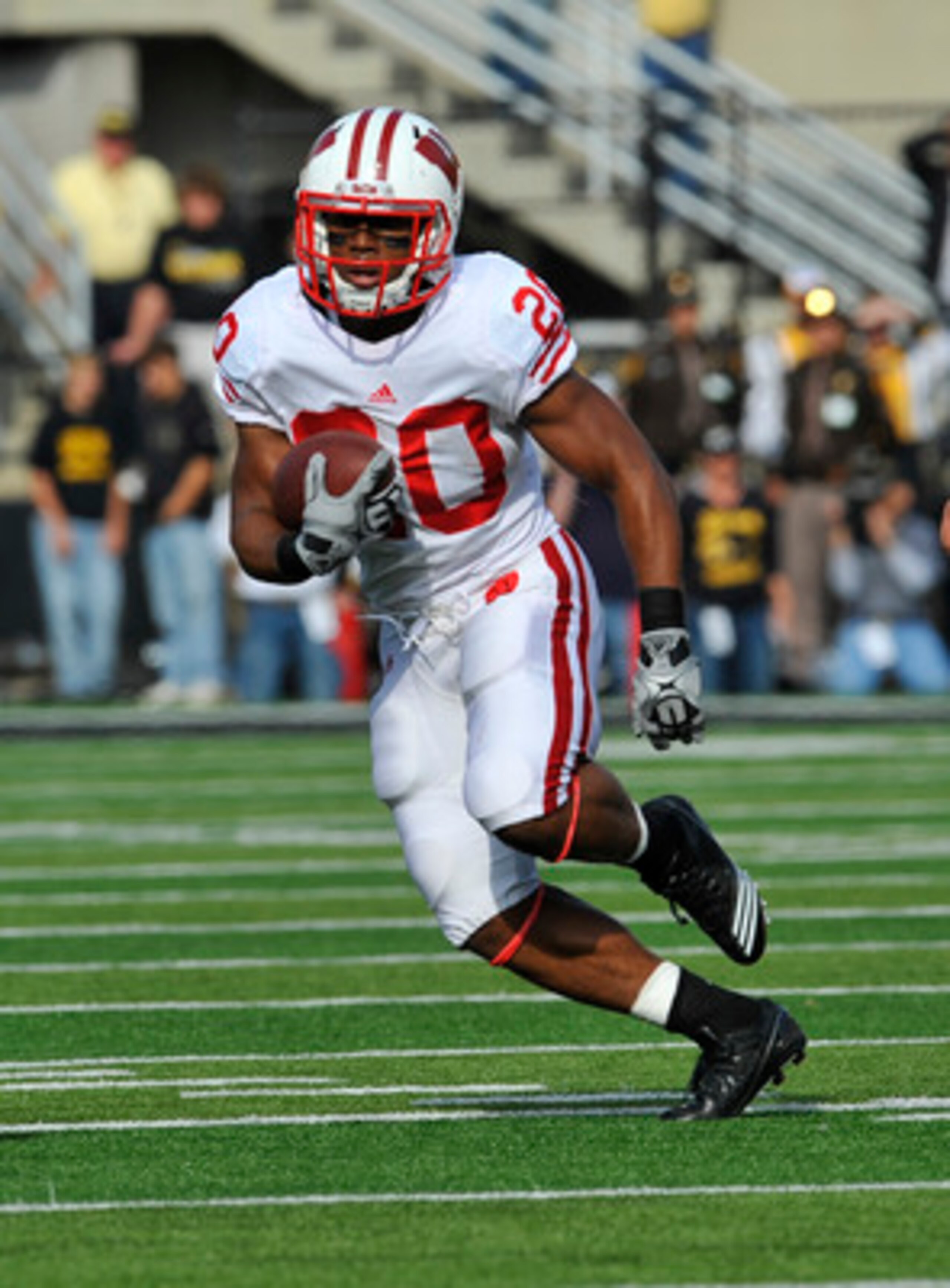 IOWA CITY, IA - OCTOBER 23- Running back James White #20 of the Wisconsin Badgers drives the ball down field against the University of Iowa Hawkeyes during the first half of play at Kinnick Stadium on October 23, 2010 in Iowa City, Iowa. Wisconsin won 31- IOWA CITY, IA - OCTOBER 23- Running back James White #20 of the Wisconsin Badgers drives the ball down field against the University of Iowa Hawkeyes during the first half of play at Kinnick Stadium on October 23, 2010 in Iowa City, Iowa. Wisconsin won 31-