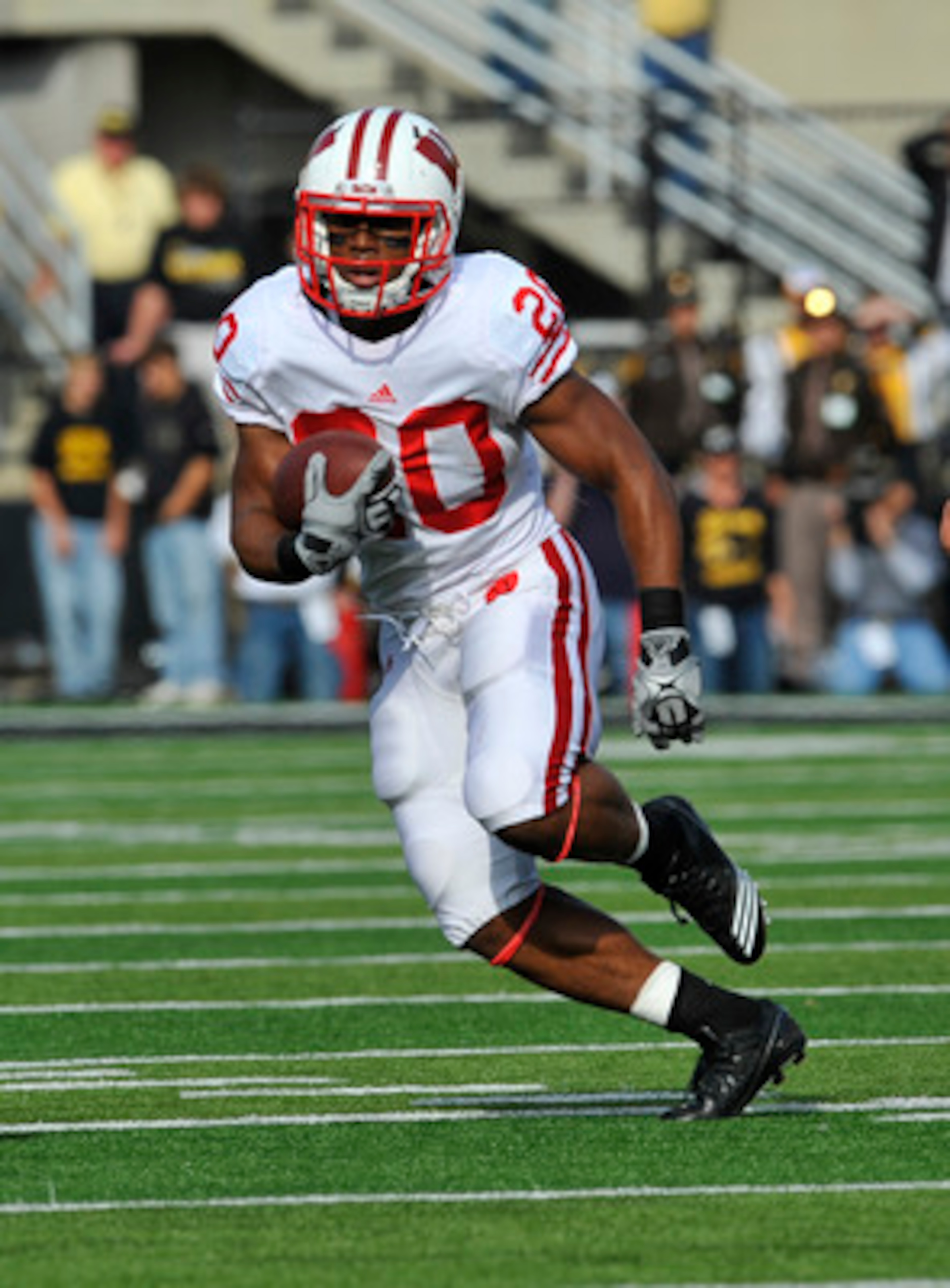 IOWA CITY, IA - OCTOBER 23- Running back James White #20 of the Wisconsin Badgers drives the ball down field against the University of Iowa Hawkeyes during the first half of play at Kinnick Stadium on October 23, 2010 in Iowa City, Iowa. Wisconsin won 31- IOWA CITY, IA - OCTOBER 23- Running back James White #20 of the Wisconsin Badgers drives the ball down field against the University of Iowa Hawkeyes during the first half of play at Kinnick Stadium on October 23, 2010 in Iowa City, Iowa. Wisconsin won 31-