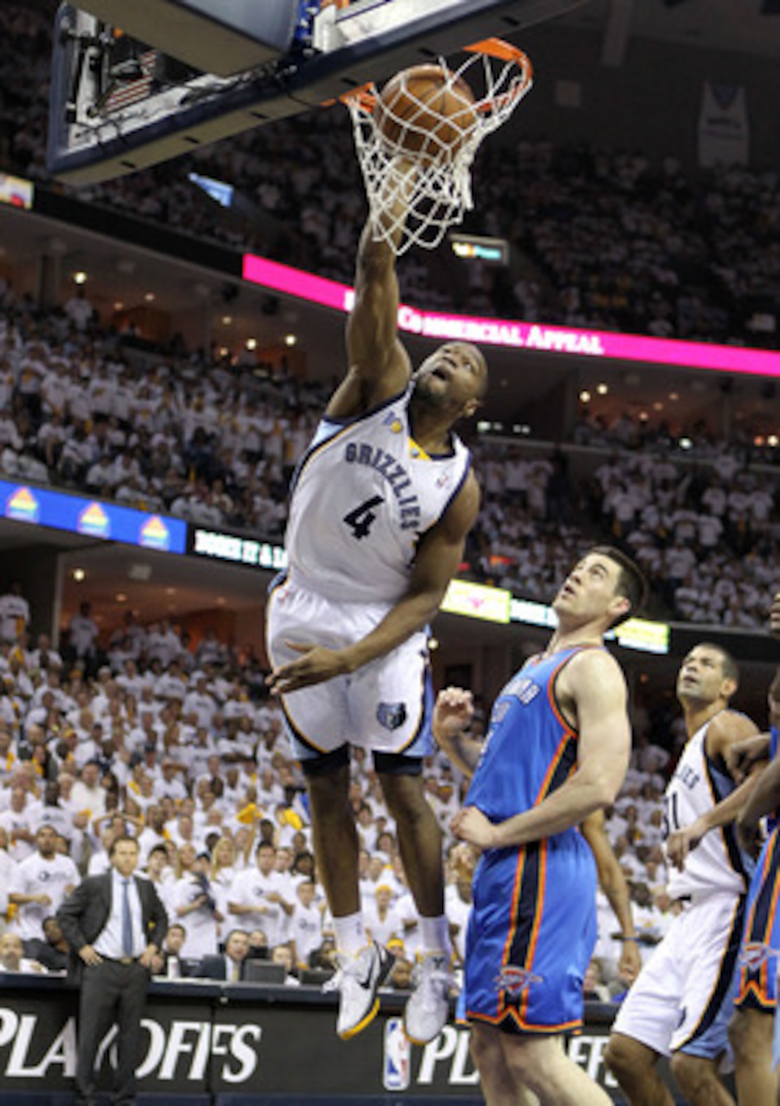 MEMPHIS, TN - MAY 07:  Sam Young #4 of the  Memphis Grizzlies shoots the ball while defended by  Nick Collison#4 of the Oklahoma City Thunder in Game Three of the Western Conference Semifinals in the 2011 NBA Playoffs at FedExForum on May 7, 2011 in Memph