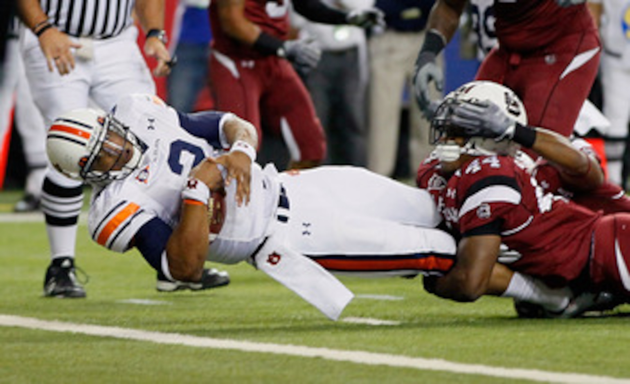 ATLANTA, GA - DECEMBER 04:  Quarterback Cam Newton #2 of the Auburn Tigers scores a touchdown against Tony Straughter #44 of the South Carolina Gamecocks during the 2010 SEC Championship at Georgia Dome on December 4, 2010 in Atlanta, Georgia.  (Photo by 