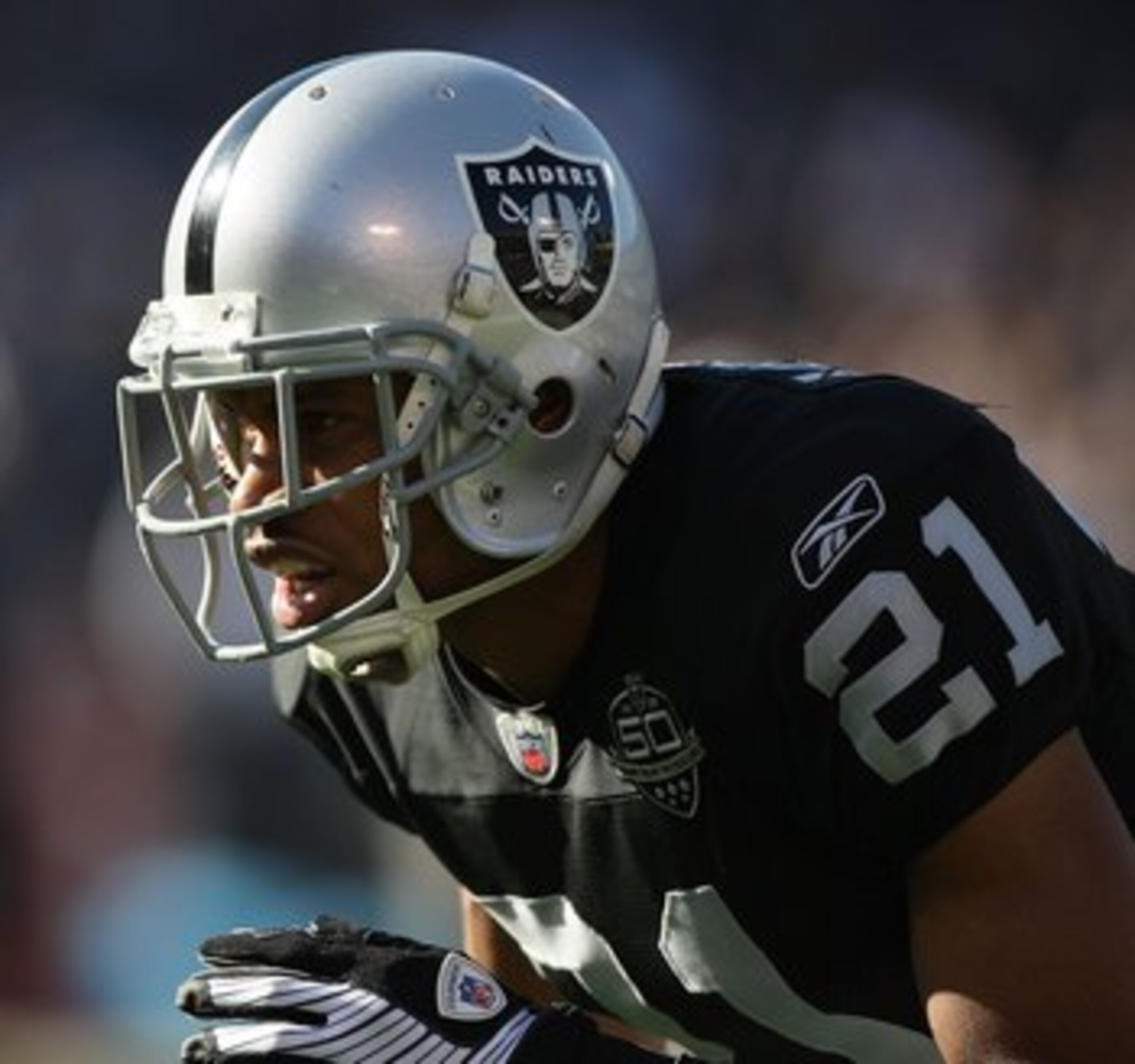 OAKLAND, CA - JANUARY 03:  Nnamdi Asomugha #21 of the Oakland Raiders in action against the Baltimore Ravens during an NFL game at Oakland-Alameda County Coliseum on January 3, 2010 in Oakland, California.  (Photo by Jed Jacobsohn/Getty Images)