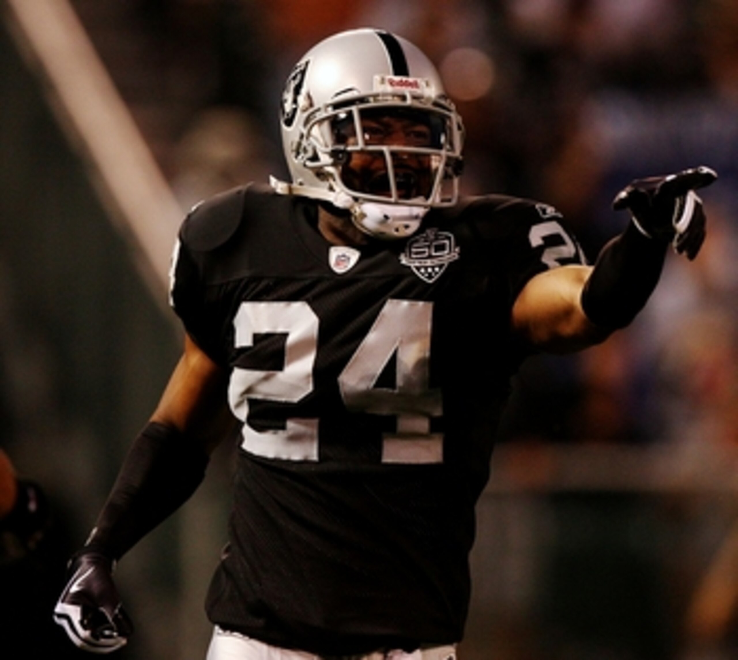 OAKLAND, CA - AUGUST 13:  Safety Michael Huff #24 of the Oakland Raiders celebrates after making an interception against the Dallas Cowboys during the preseason game at Oakland-Alameda County Coliseum on August 13, 2009 in Oakland, California. (Photo by J