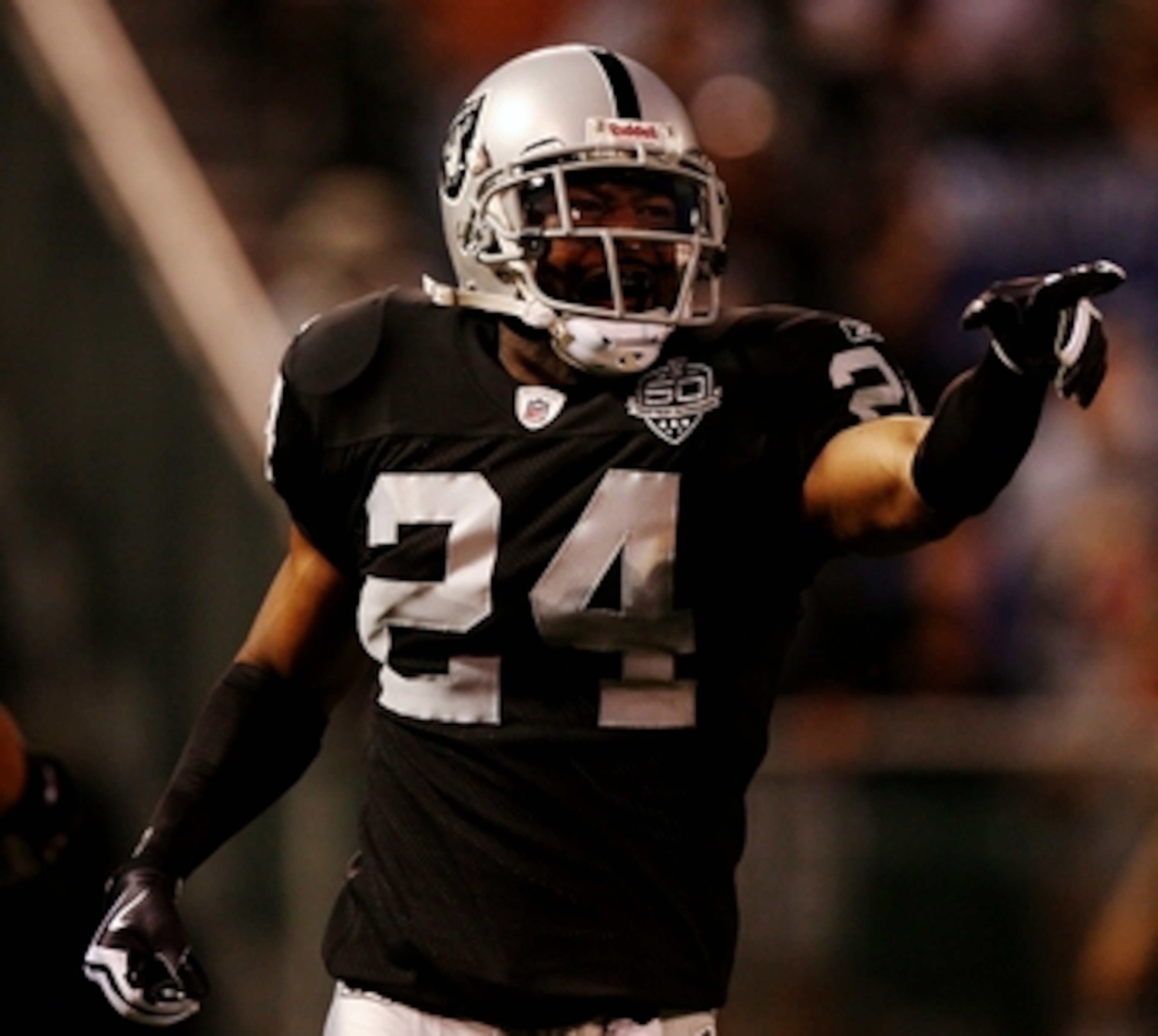 OAKLAND, CA - AUGUST 13: Safety Michael Huff #24 of the Oakland Raiders celebrates after making an interception against the Dallas Cowboys during the preseason game at Oakland-Alameda County Coliseum on August 13, 2009 in Oakland, California. (Photo by J OAKLAND, CA - AUGUST 13: Safety Michael Huff #24 of the Oakland Raiders celebrates after making an interception against the Dallas Cowboys during the preseason game at Oakland-Alameda County Coliseum on August 13, 2009 in Oakland, California. (Photo by J
