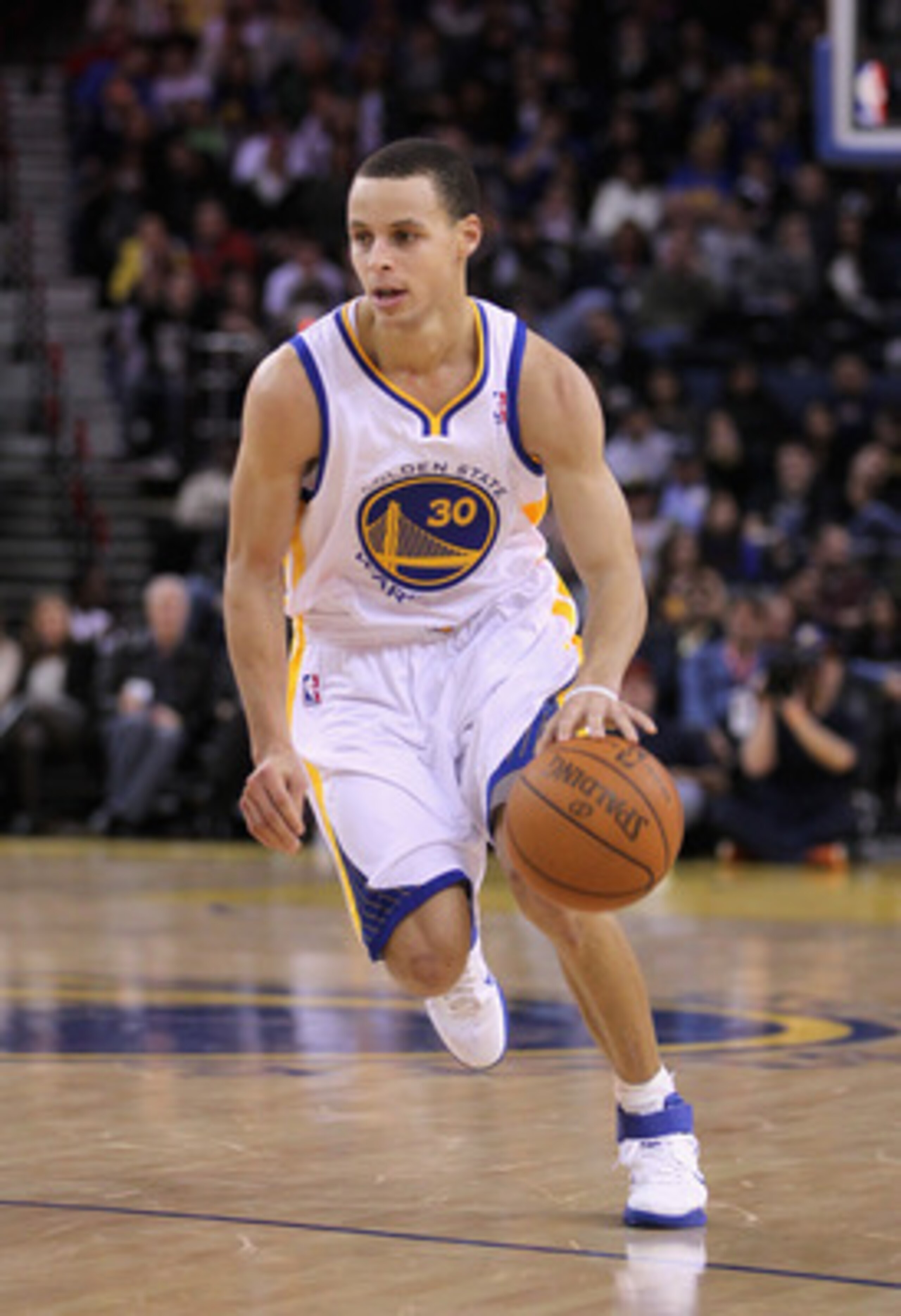 OAKLAND, CA - MARCH 25:  Stephen Curry #30 of the Golden State Warriors in action against the Toronto Raptors at Oracle Arena on March 25, 2011 in Oakland, California. NOTE TO USER: User expressly acknowledges and agrees that, by downloading and or using 