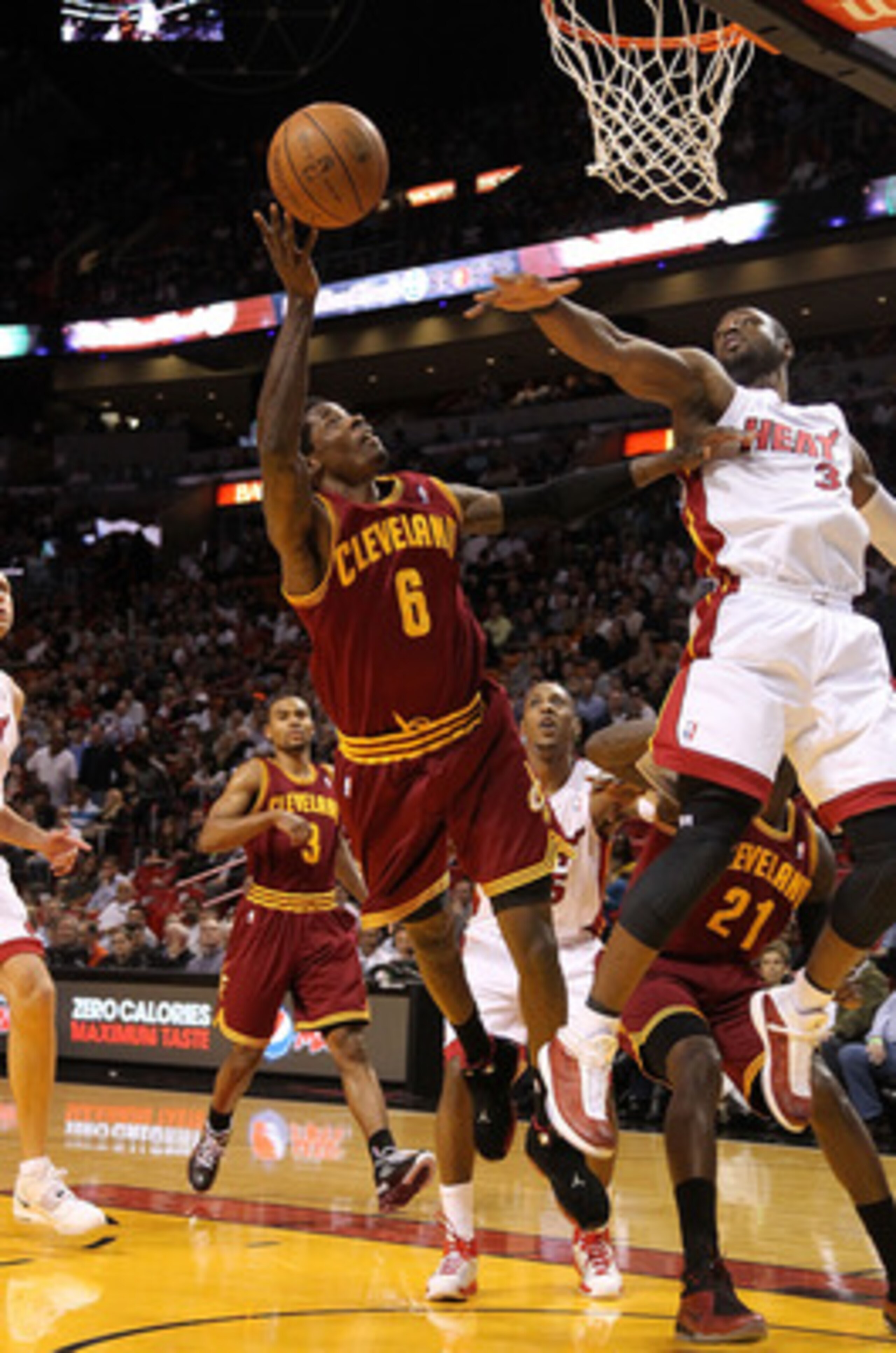 MIAMI, FL - JANUARY 31:  Manny Harris #6 of the  Cleveland Cavaliers shoots over Dwyane Wade #3 of the Miami Heat during a game against at American Airlines Arena on January 31, 2011 in Miami, Florida. NOTE TO USER: User expressly acknowledges and agrees 