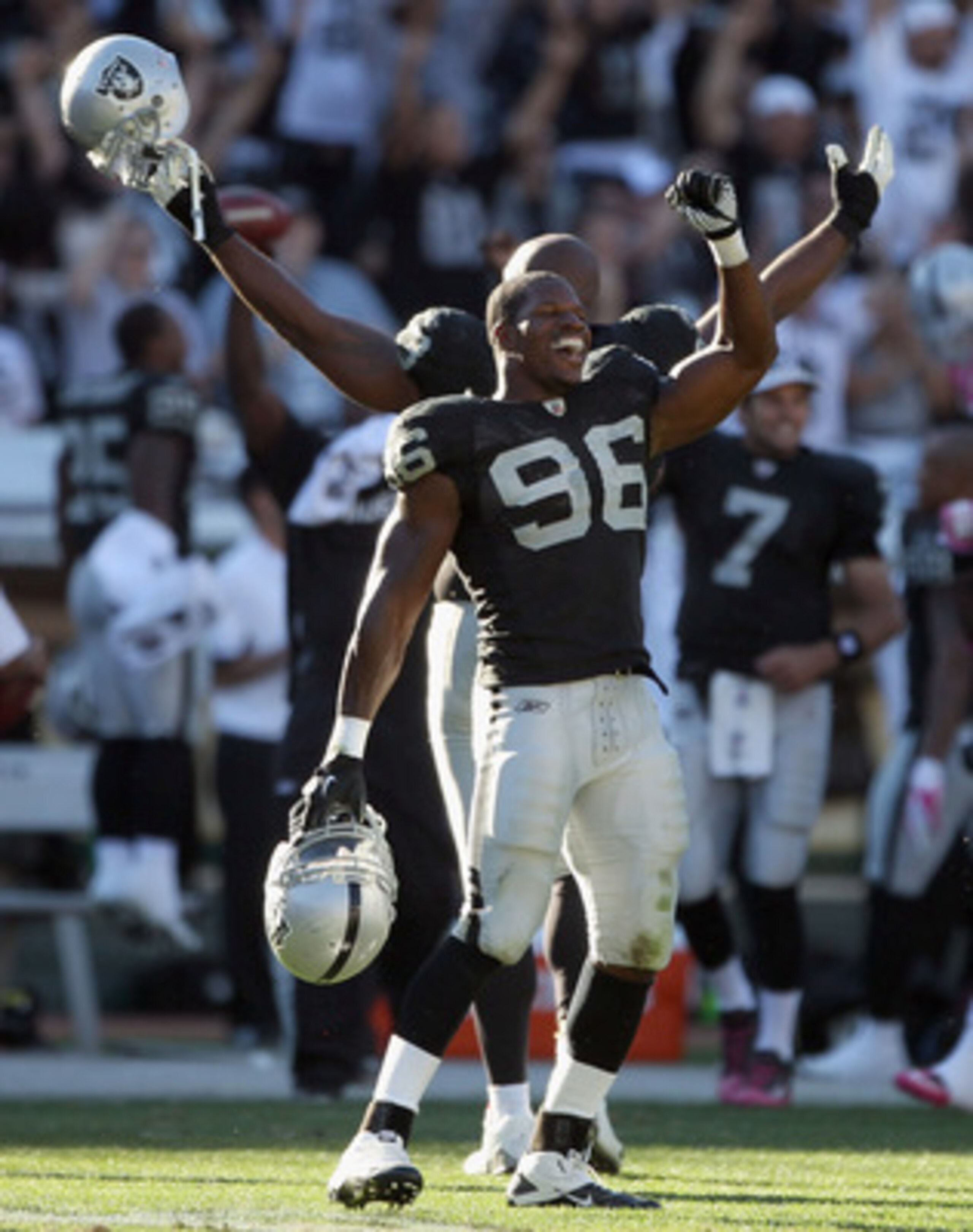 OAKLAND, CA - OCTOBER 10:  Kamerion Wimbley #96 and the rest of the Oakland Raiders celebrate after a replay review ruled that the Tyvon Branch fumble return was a touchdown in the fourth quarter of their game against the San Diego Chargers at Oakland-Ala