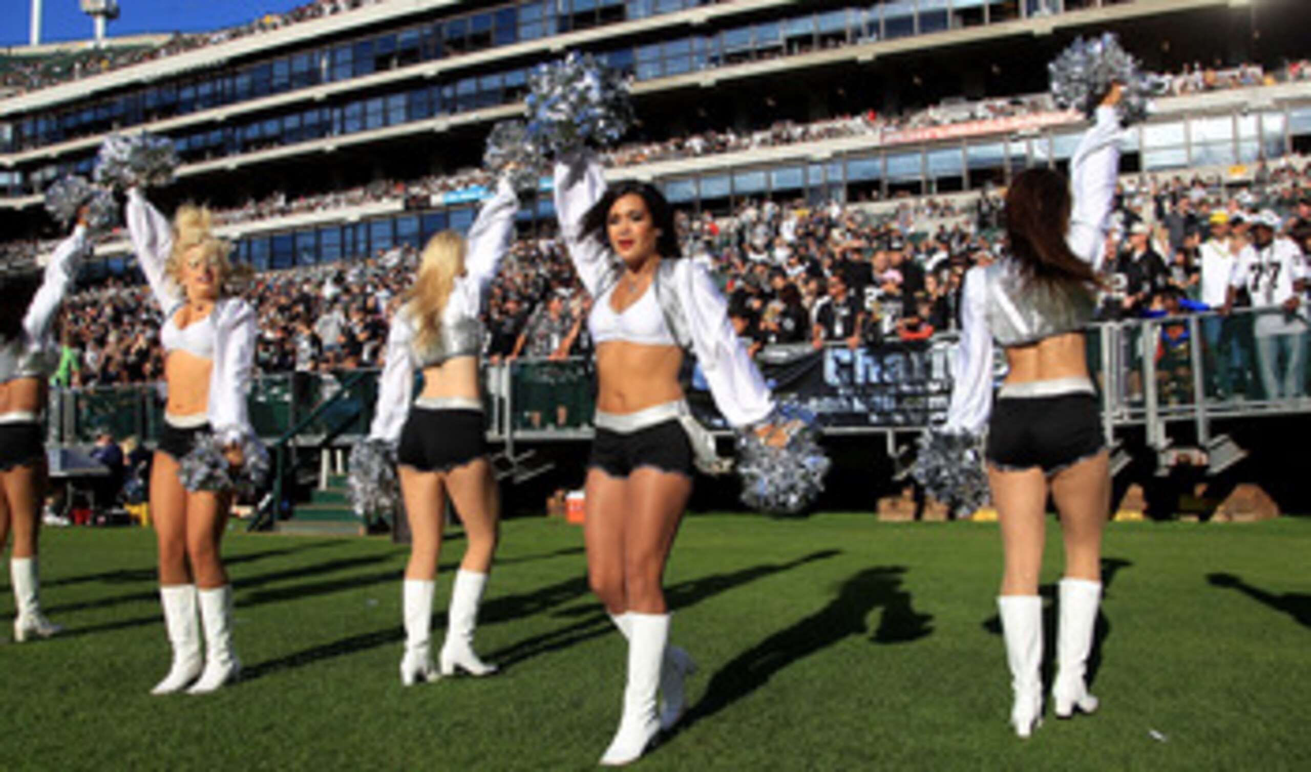 OAKLAND, CA - OCTOBER 31:  The Raiderettes cheer for their team during the Seattle Seahawks game against the Oakland Raiders at Oakland-Alameda County Coliseum on October 31, 2010 in Oakland, California.  (Photo by Ezra Shaw/Getty Images)