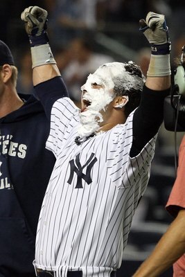 NEW YORK - SEPTEMBER 08:  Nick Swisher #33 of the New York Yankees celebrates his game winning walk off home run against the Tampa Bay Rays after receiving a shaving cream pie from teammate A.J. Burnett (not pictured) on September 8, 2009 at Yankee Stadiu