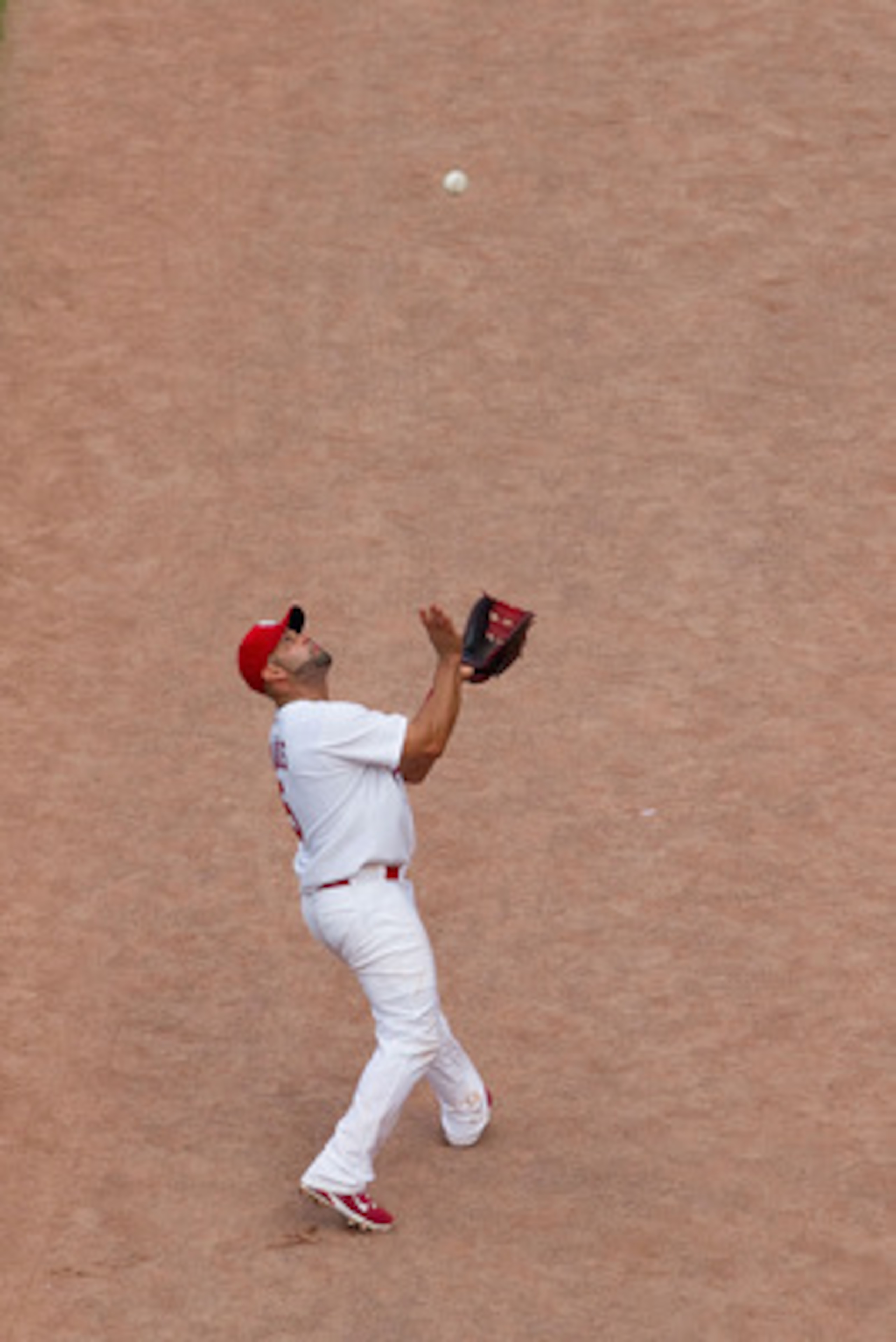 ST. LOUIS, MO - MAY 7: Albert Pujols #5 of the St. Louis Cardinals catches a pop fly against the Milwaukee Brewers at Busch Stadium on May 7, 2011 in St. Louis, Missouri.  (Photo by Dilip Vishwanat/Getty Images)