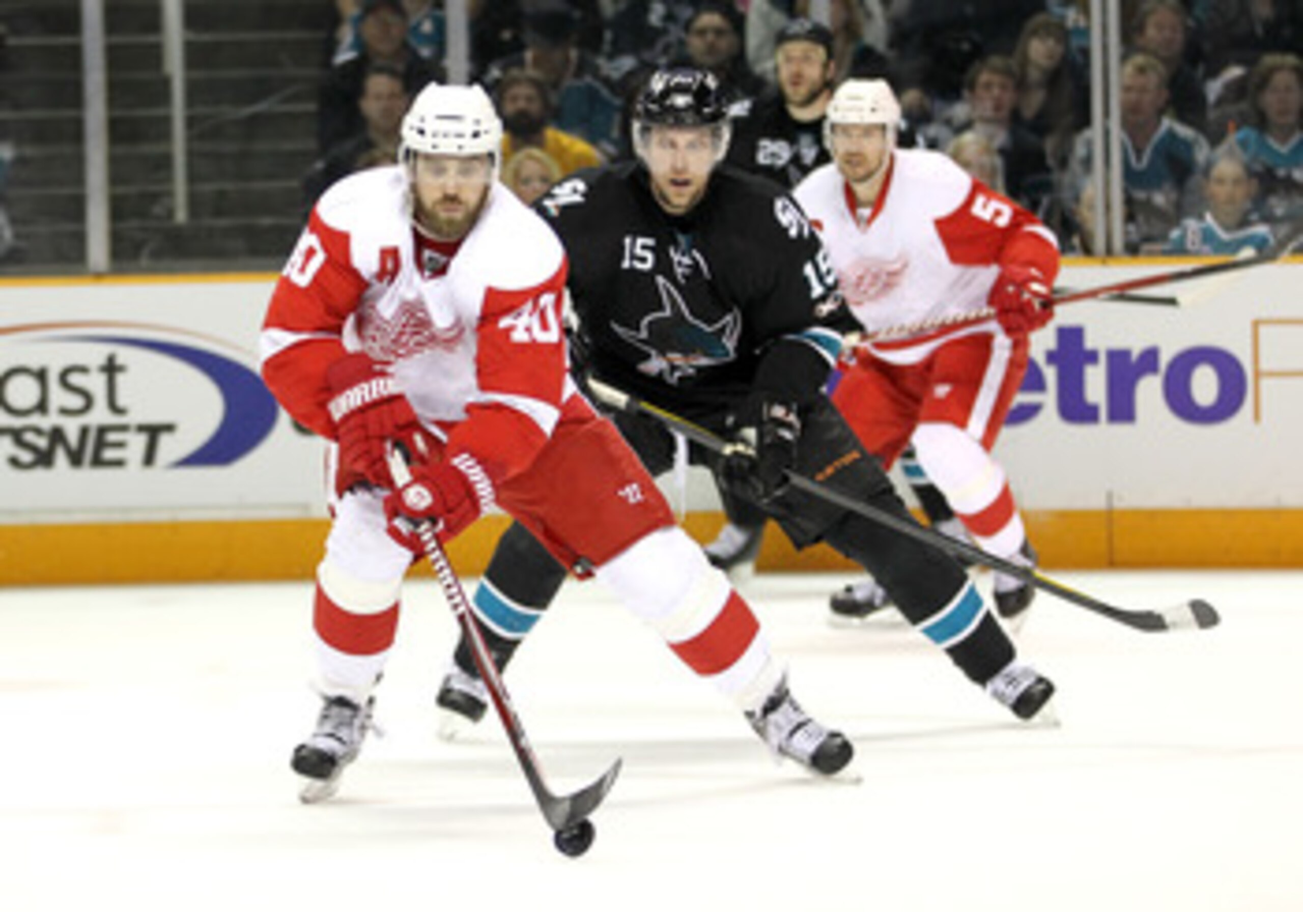 SAN JOSE, CA - MAY 08:  Henrik Zetterberg #40 of the Detroit Red Wings skates away from Dany Heatley #15 of the San Jose Sharks in Game Five of the Western Conference Semifinals during the 2011 NHL Stanley Cup Playoffs at HP Pavilion on May 8, 2011 in San