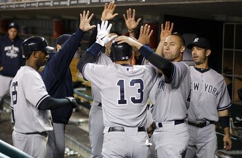 DETROIT, MI - MAY 02: Alex Rodriguez #13 of the New York Yankees celebrates with teammates in the dugout after scoring a ninth inning run while playing the Detroit Tigers at Comerica Park on May 2, 2011 in Detroit, Michigan. New York won the game 5-3.  (P