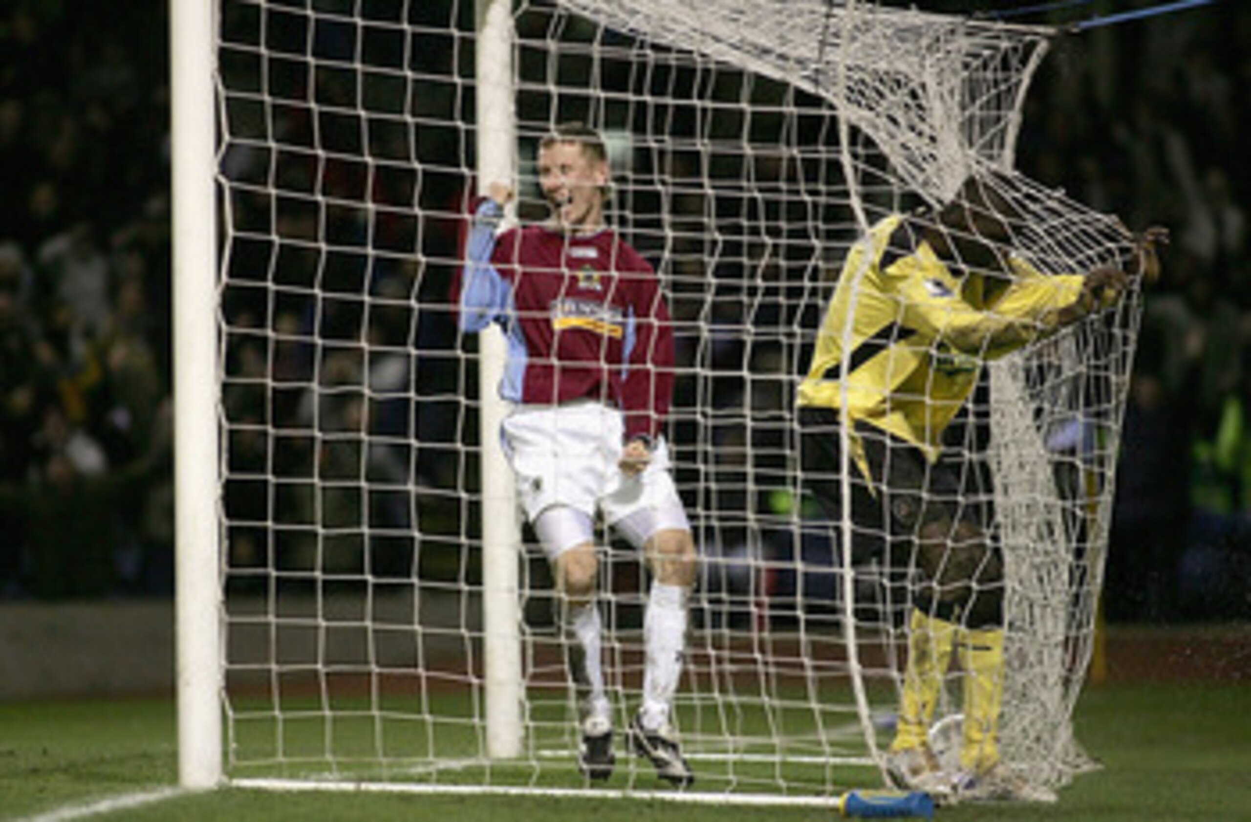 BURNLEY, ENGLAND - JANUARY 18: Lee Roche (left) of Burnley celebrates the own goal scored by Djimi Traore of Liverpool during the FA Cup third round match between Burnley and Liverpool at Turf Moor on January 18, 2005 in Burnley, England. (Photo by Micha BURNLEY, ENGLAND - JANUARY 18: Lee Roche (left) of Burnley celebrates the own goal scored by Djimi Traore of Liverpool during the FA Cup third round match between Burnley and Liverpool at Turf Moor on January 18, 2005 in Burnley, England. (Photo by Micha