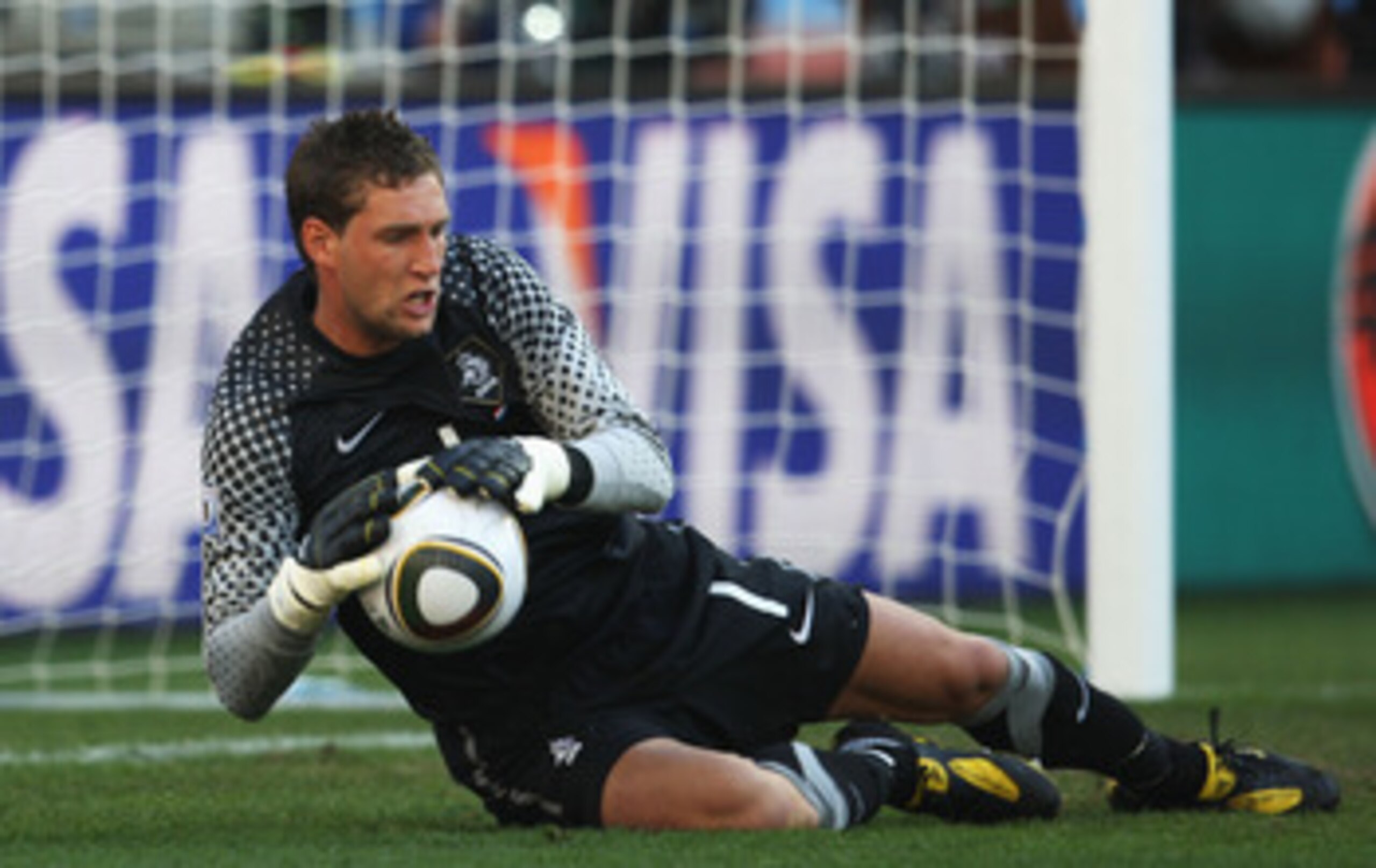 DURBAN, SOUTH AFRICA - JUNE 19:  Maarten Stekelenburg of the Netherlands saves a shot during the 2010 FIFA World Cup South Africa Group E match between Netherlands and Japan at Durban Stadium on June 19, 2010 in Durban, South Africa.  (Photo by Steve Haag