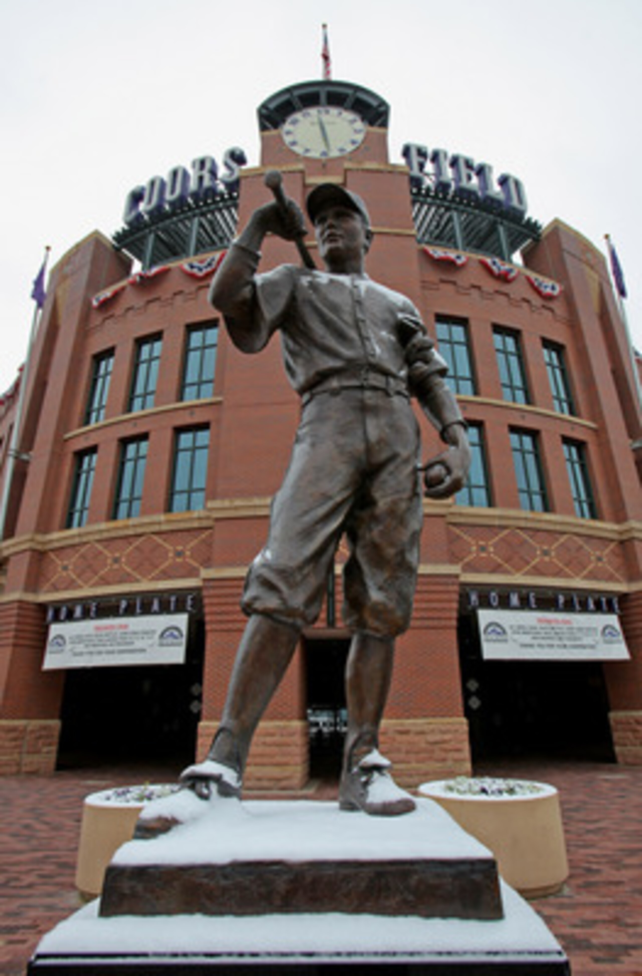 DENVER - OCTOBER 10:  The statue of 'The Player' is dusted with snow outside the stadium as Game 3 of the National League Division series between the Philadelphia Phillies and the Colorado Rockies at Coors Field has been postponed due to inclement weather
