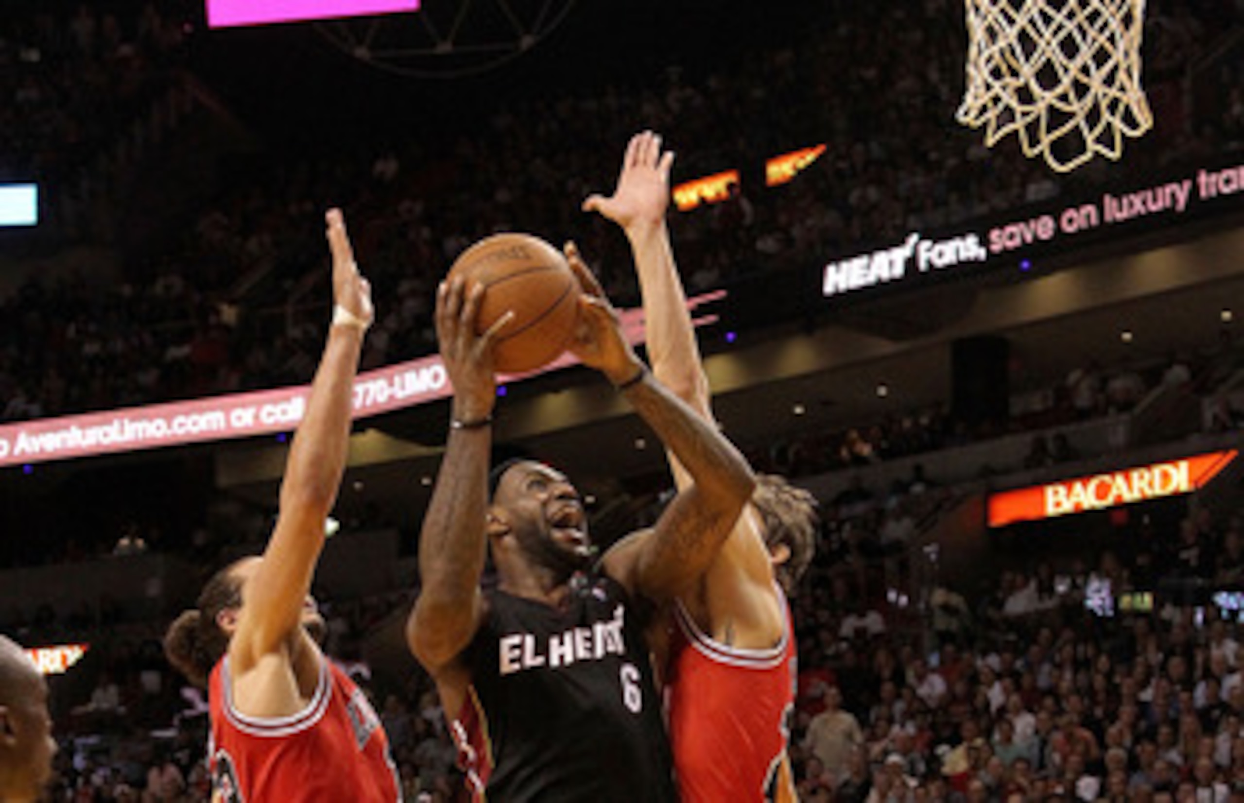 MIAMI, FL - MARCH 06: LeBron James #6 of the Miami Heat shoots over Joakim Noah #13 and Omer Asik #3 of the Chicago Bulls during a game at American Airlines Arena on March 6, 2011 in Miami, Florida. NOTE TO USER: User expressly acknowledges and agrees th MIAMI, FL - MARCH 06: LeBron James #6 of the Miami Heat shoots over Joakim Noah #13 and Omer Asik #3 of the Chicago Bulls during a game at American Airlines Arena on March 6, 2011 in Miami, Florida. NOTE TO USER: User expressly acknowledges and agrees th