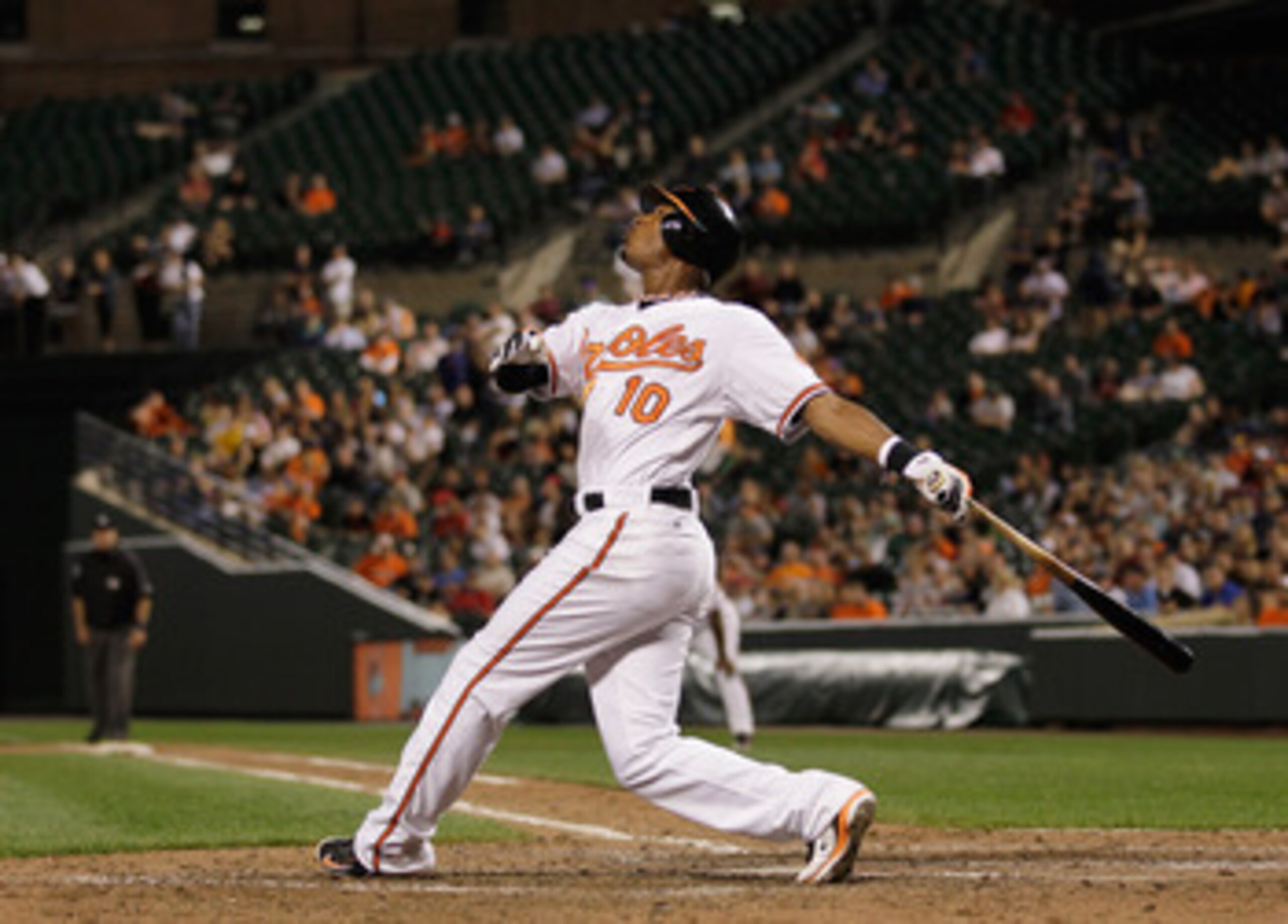 BALTIMORE, MD - APRIL 28:  Adam Jones #10 of the Baltimore Orioles at the plate against the Boston Red Sox at Oriole Park at Camden Yards on April 28, 2011 in Baltimore, Maryland.  (Photo by Rob Carr/Getty Images)