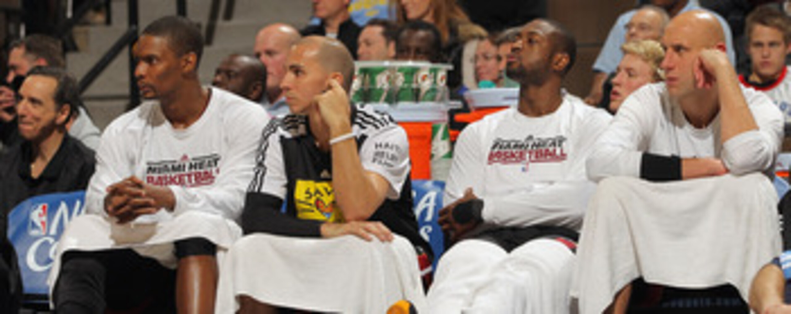 DENVER, CO - JANUARY 13: (L-R) Chris Bosh #1, Carlos Arroyo #8, Dwayne Wade #3 and Zydrunas Ilgaukas #11 of the Miami Heat sit on the bench in the fourth quarter against the Denver Nuggets at the Pepsi Center on January 13, 2011 in Denver, Colorado. The DENVER, CO - JANUARY 13: (L-R) Chris Bosh #1, Carlos Arroyo #8, Dwayne Wade #3 and Zydrunas Ilgaukas #11 of the Miami Heat sit on the bench in the fourth quarter against the Denver Nuggets at the Pepsi Center on January 13, 2011 in Denver, Colorado. The