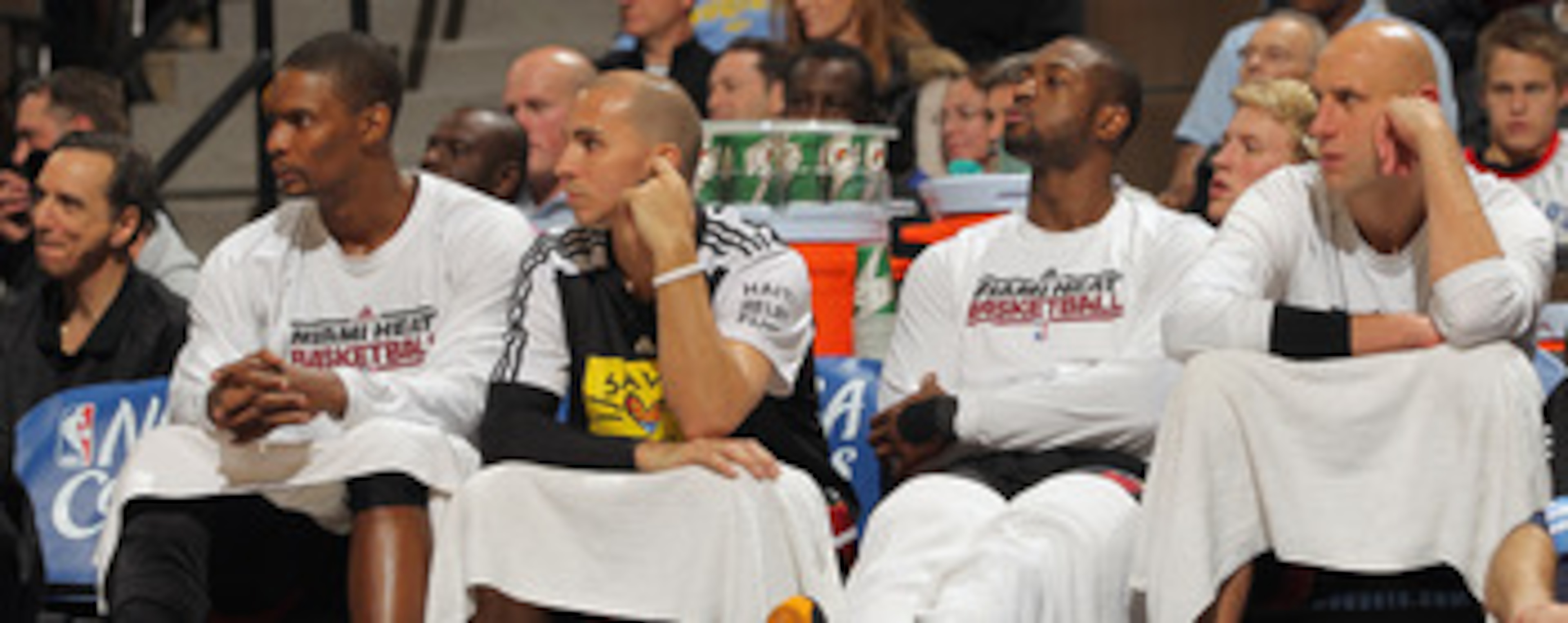 DENVER, CO - JANUARY 13:  (L-R) Chris Bosh #1, Carlos Arroyo #8, Dwayne Wade #3 and Zydrunas Ilgaukas #11 of the Miami Heat sit on the bench in the fourth quarter against the Denver Nuggets at the Pepsi Center on January 13, 2011 in Denver, Colorado. The 