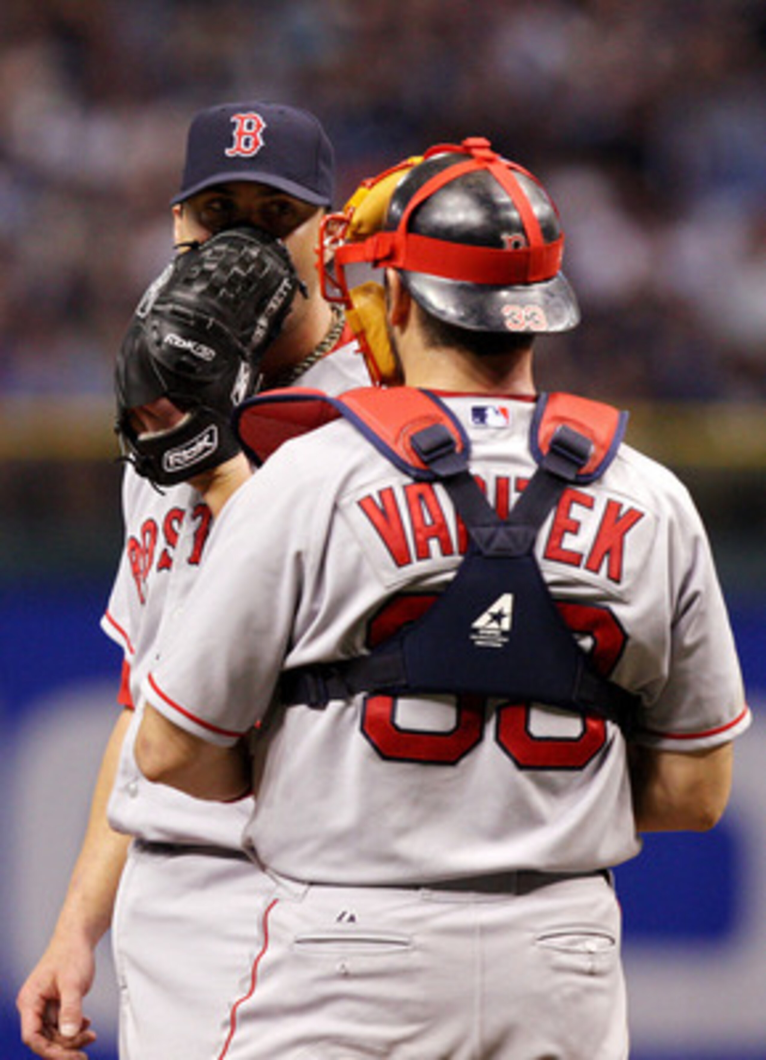 ST PETERSBURG, FL - OCTOBER 18:  Starting pitcher Josh Beckett #19 of the Boston Red Sox talks with his catcher Jason Varitek #33 against the Tampa Bay Rays in game six of the American League Championship Series during the 2008 MLB playoffs on October 18,