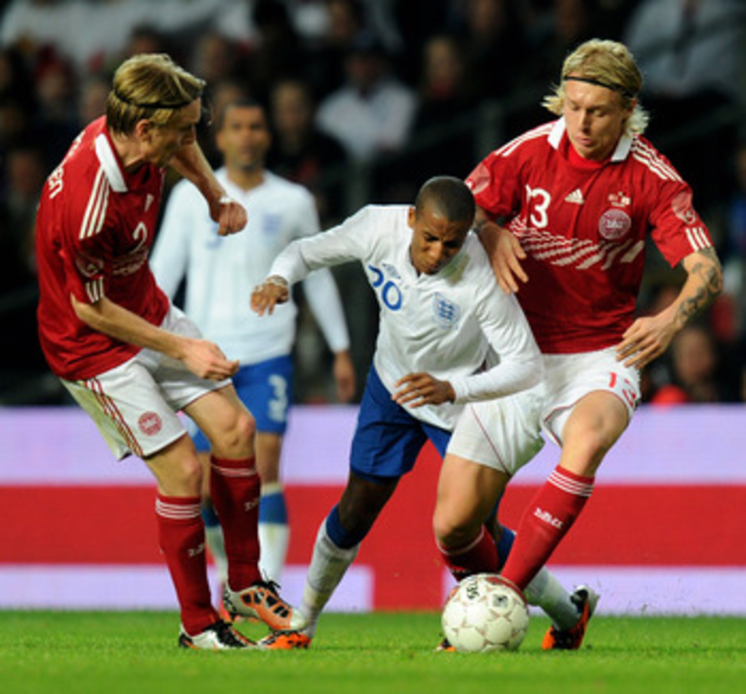 COPENHAGEN, DENMARK - FEBRUARY 09: Ashley Young of England is challenged by Simon Kjaer of Denmark during the International Friendly match between Denmark and England at Parken Stadium on February 9, 2011 in Copenhagen, Denmark. (Photo by Mike Hewitt/Ge COPENHAGEN, DENMARK - FEBRUARY 09: Ashley Young of England is challenged by Simon Kjaer of Denmark during the International Friendly match between Denmark and England at Parken Stadium on February 9, 2011 in Copenhagen, Denmark. (Photo by Mike Hewitt/Ge