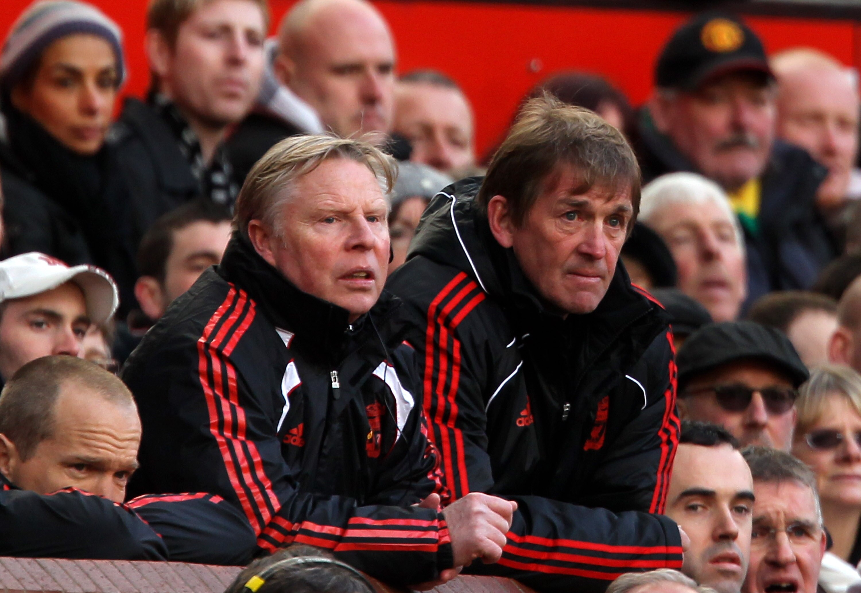 MANCHESTER, ENGLAND - JANUARY 09:  Liverpool Manager Kenny Dalglish looks on with Assistant Sammy Lee (L) during the FA Cup sponsored by E.ON 3rd round match between Manchester United and Liverpool at Old Trafford on January 9, 2011 in Manchester, England