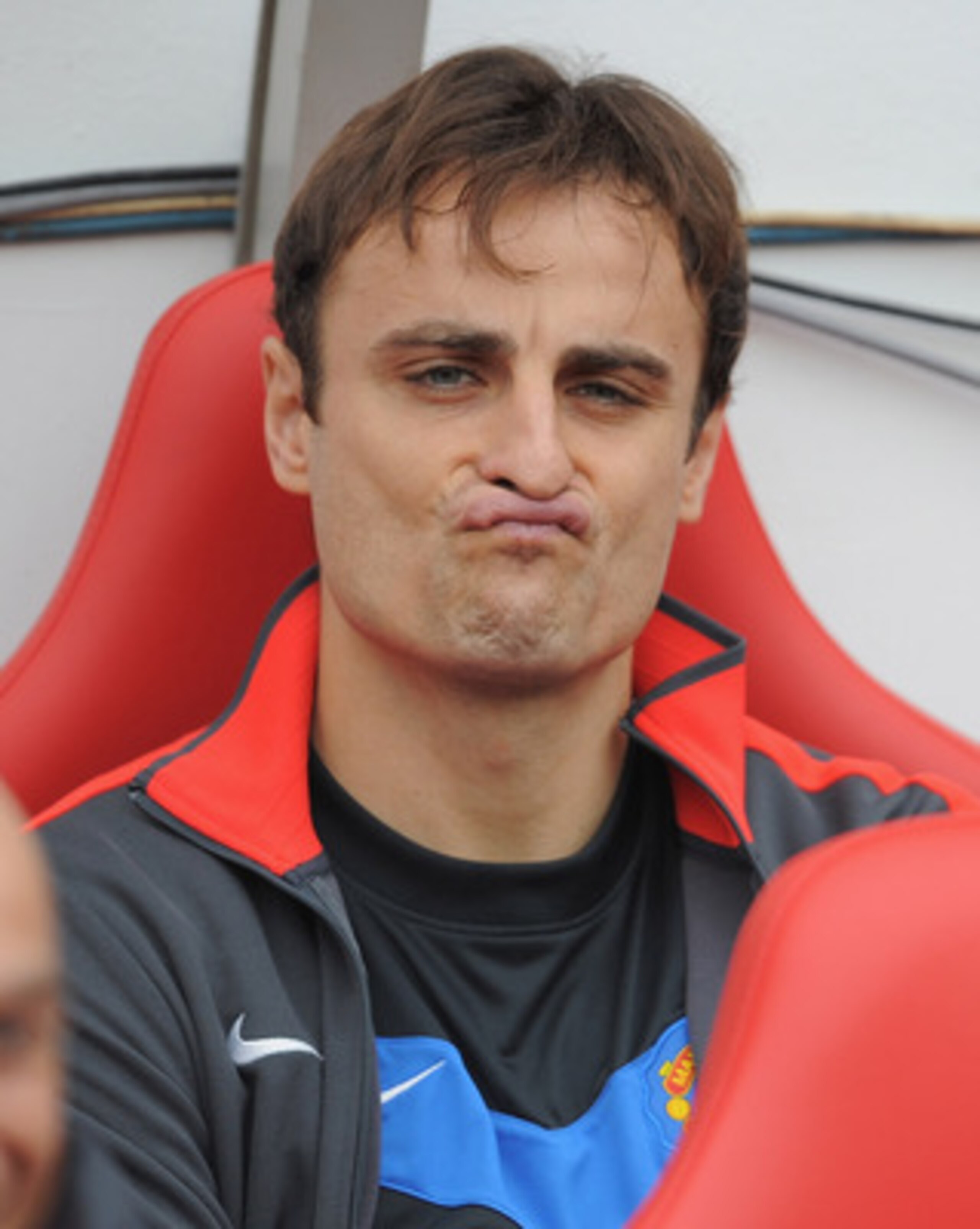 SUNDERLAND, ENGLAND - OCTOBER 02: Dimitar Berbatov of Manchester United sits on the bench during the Barclays Premier League match between Sunderland and Manchester United at the Stadium of Light on October 2, 2010 in Sunderland, England.  (Photo by Micha