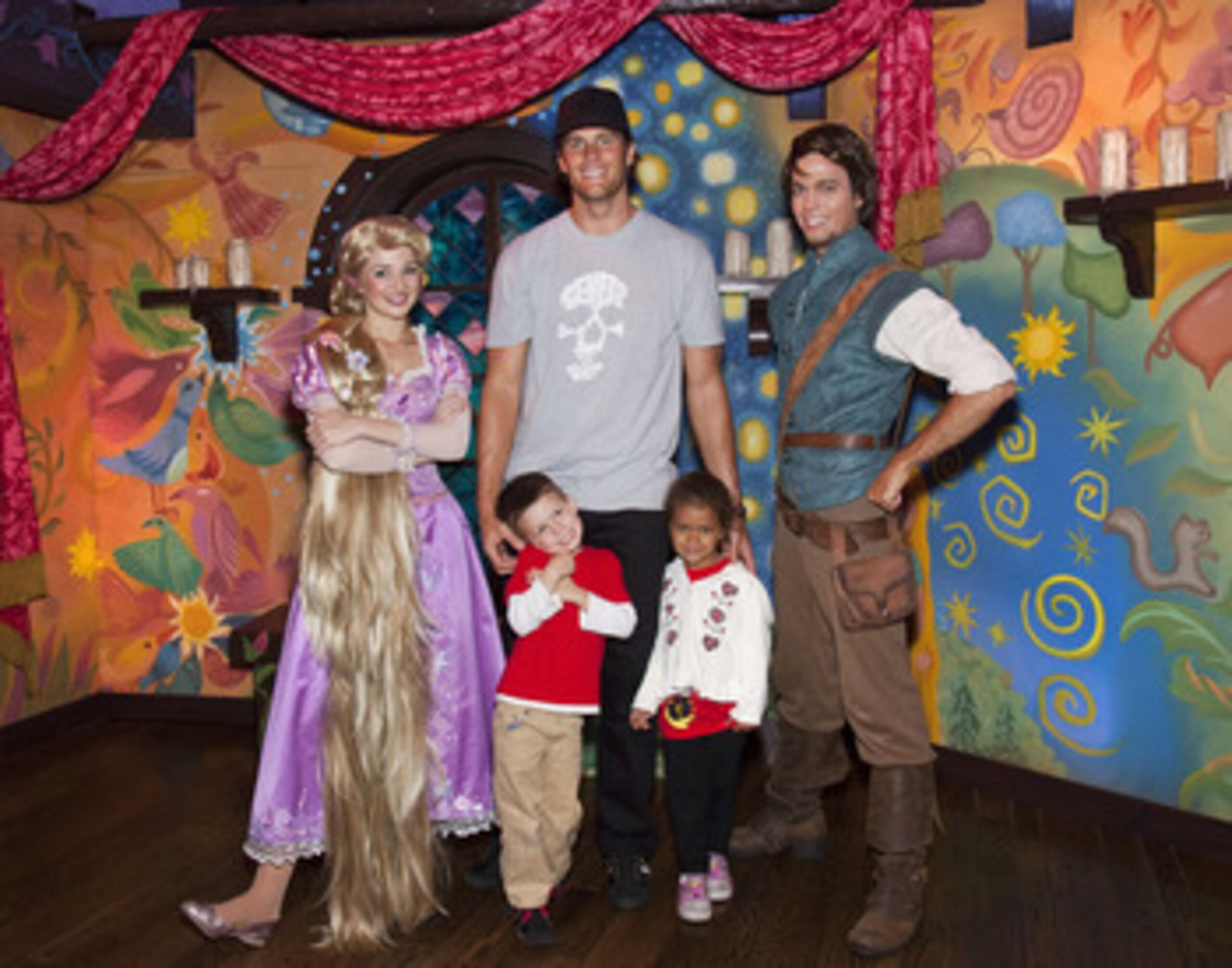 ANAHEIM, CA - APRIL 21:  In this handout photo provided by Disney Parks, New England Patriots Quarterback Tom Brady, his son Jack (4) and niece Jordan (5), meet Rapunzel and Flynn Rider of Disney's animated film, 'Tangled,' while celebrating Jordan's fift