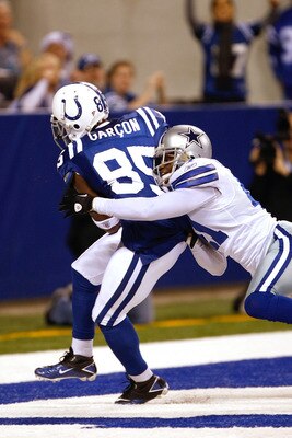 INDIANAPOLIS, IN - DECEMBER 05: Pierre Garcon #85 of the Indianapolis Colts scores a touchdown as Terrence Newman #41 of the Dallas Cowboys defends at Lucas Oil Stadium on December 5, 2010 in Indianapolis, Indiana.  (Photo by Scott Boehm/Getty Images)