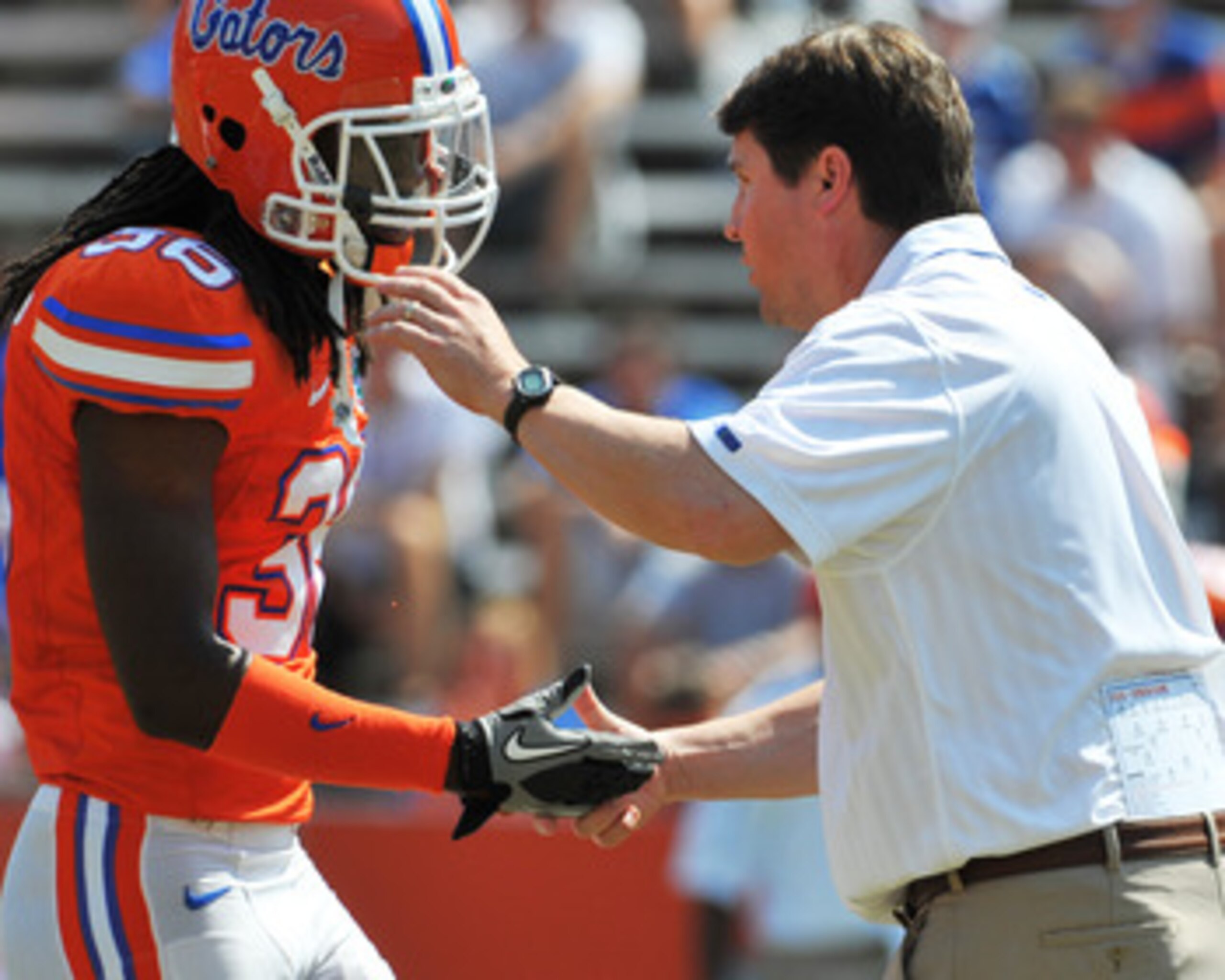 GAINESVILLE, FL - APRIL 9:  Coach Will Muschamp of the Florida Gators congratulates cornerback Moses Jenkins #36 during the Orange and Blue spring football game April 9, 2011 at Ben Hill Griffin Stadium in Gainesville, Florida.  (Photo by Al Messerschmidt