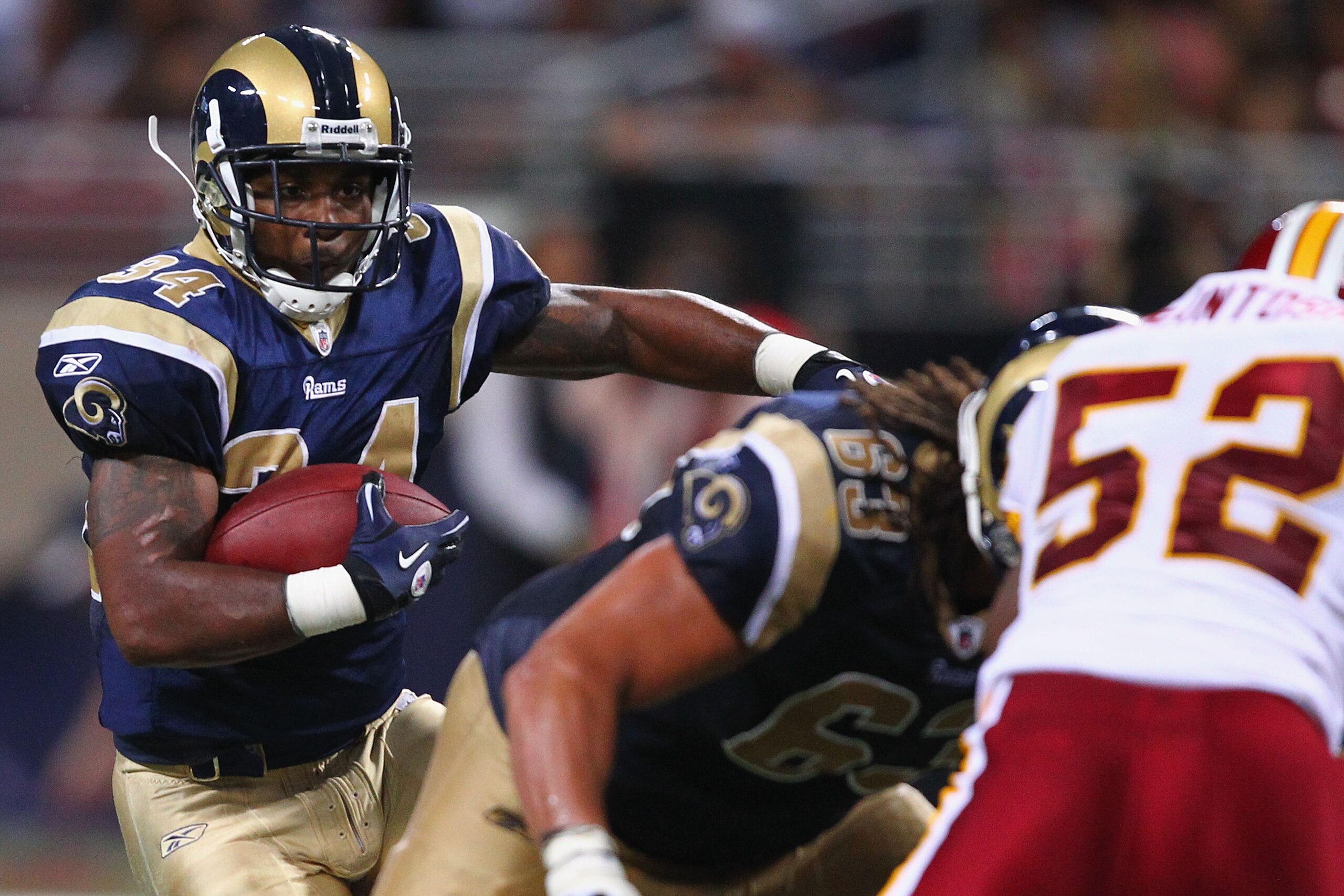 ST. LOUIS - SEPTEMBER 26: Kenneth Darby #34 of the St. Louis Rams rushes against the Washington Redskins at the Edward Jones Dome on September 26, 2010 in St. Louis, Missouri.  The Rams beat the Redskins 30-16.  (Photo by Dilip Vishwanat/Getty Images)